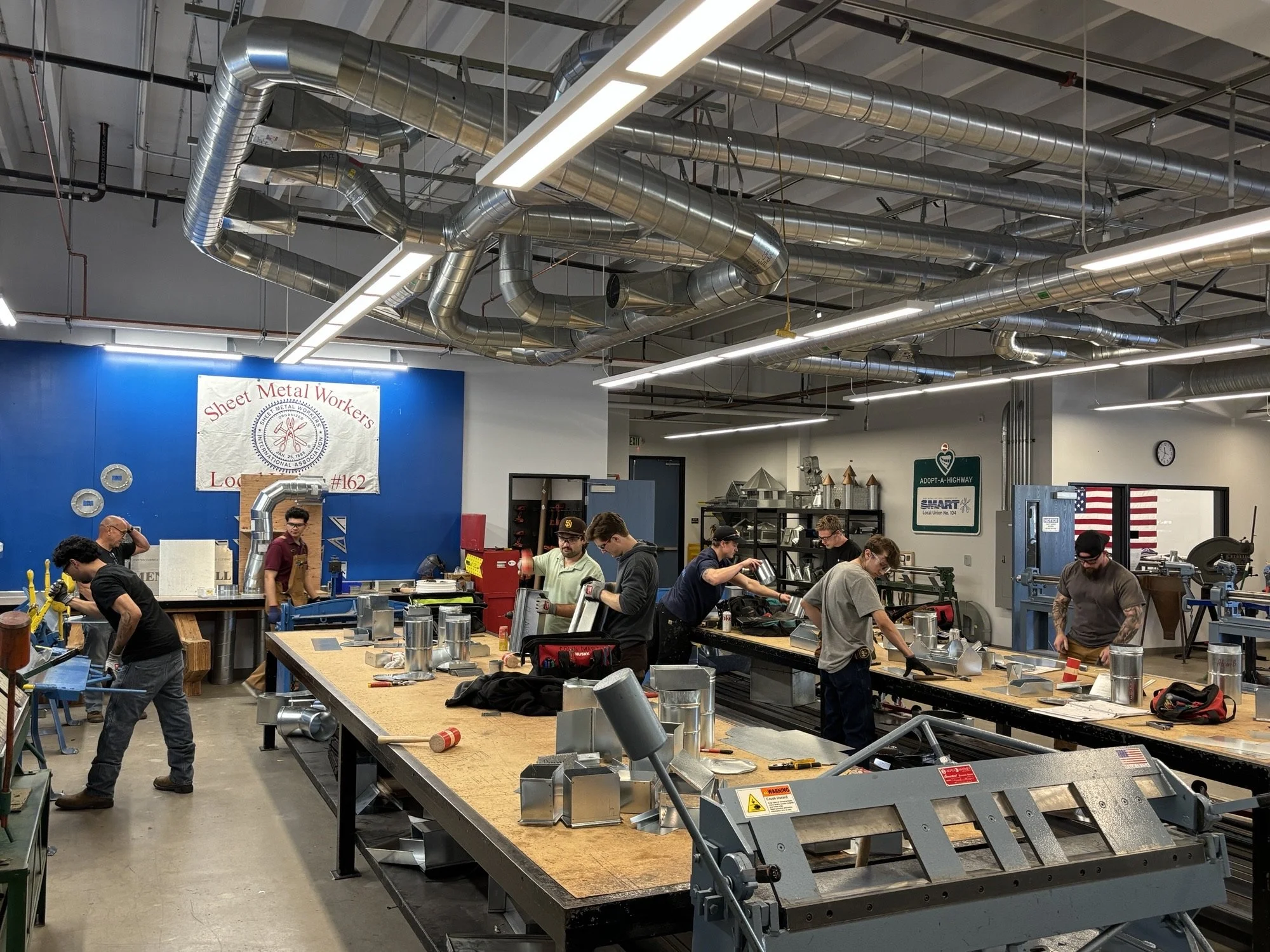 First-year Sheet Metal apprentices develop drafting, fitting-layout, and fabrication skills by transforming their technical drawings into finished fittings.