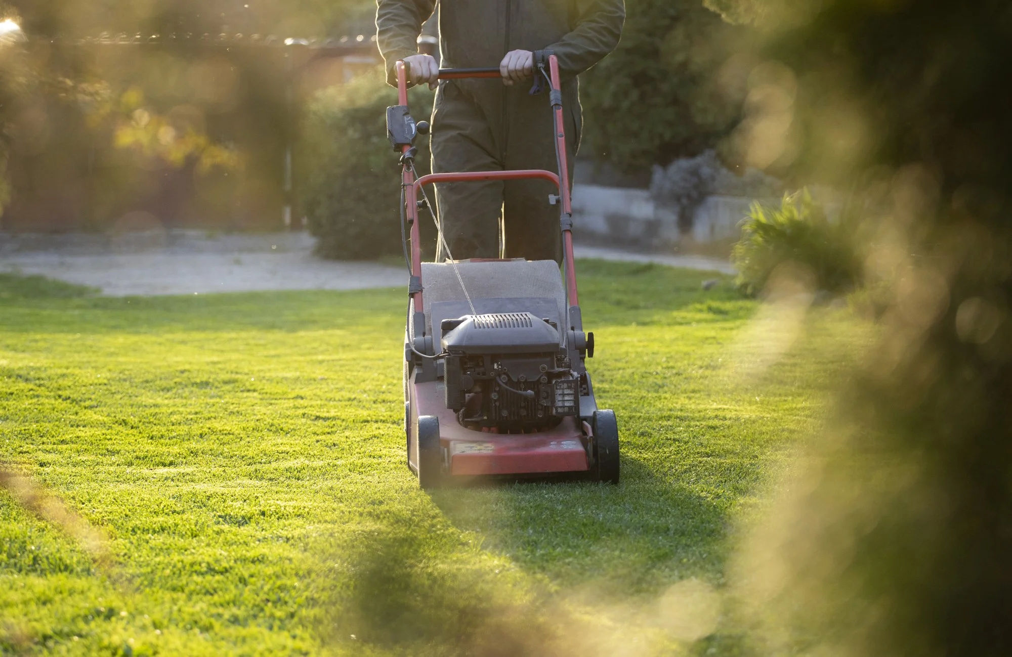 garden-worker-with-lawn-mover-garden-works-in-spr-2025-03-26-18-10-09-utc.jpg