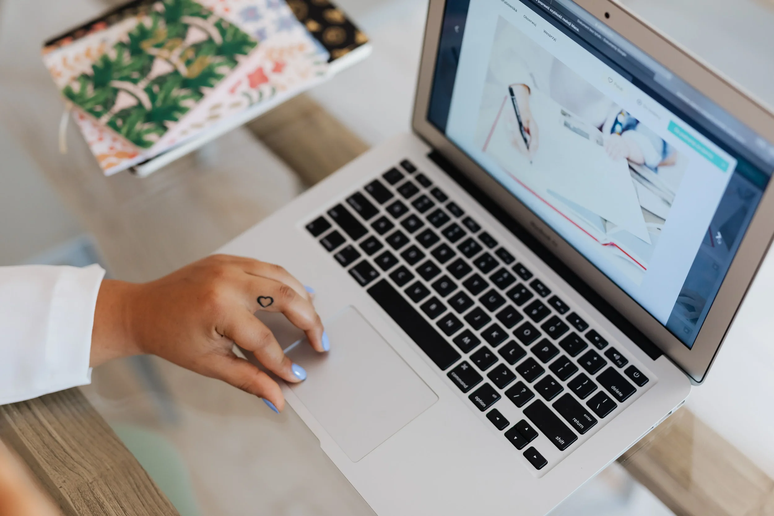 Therapist working on a laptop while creating blog content to improve SEO, online visibility, and client discovery for a private practice.