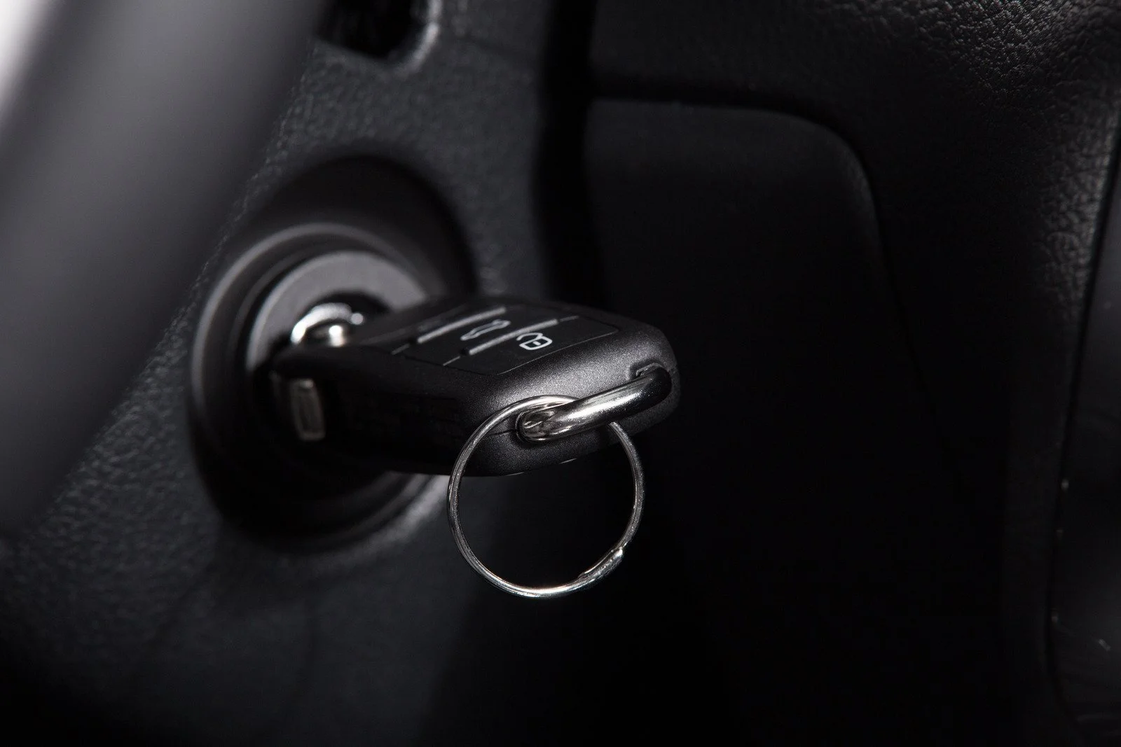 Car key inserted into ignition switch.