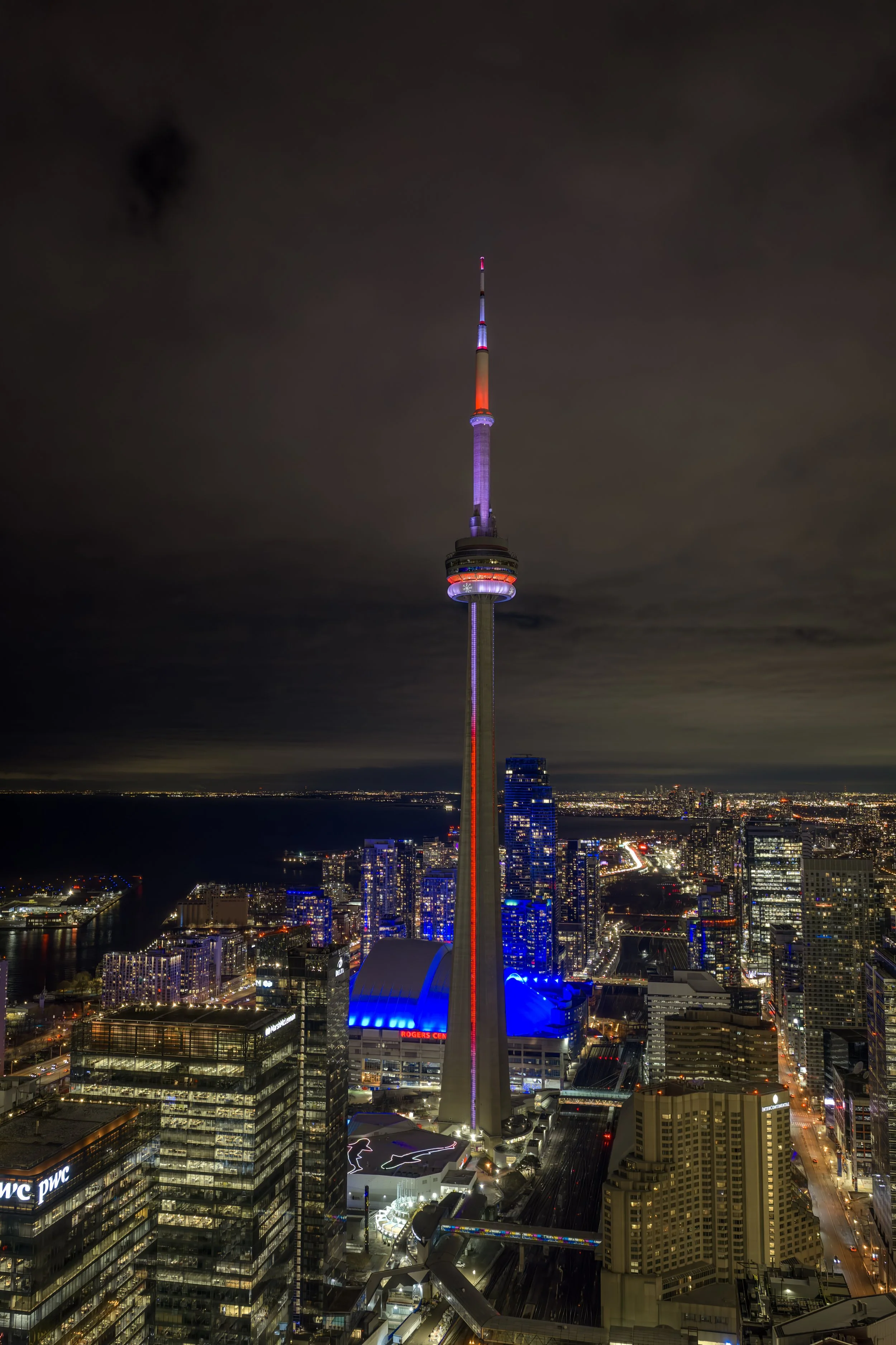 Night view with CN Tower glowing over Toronto