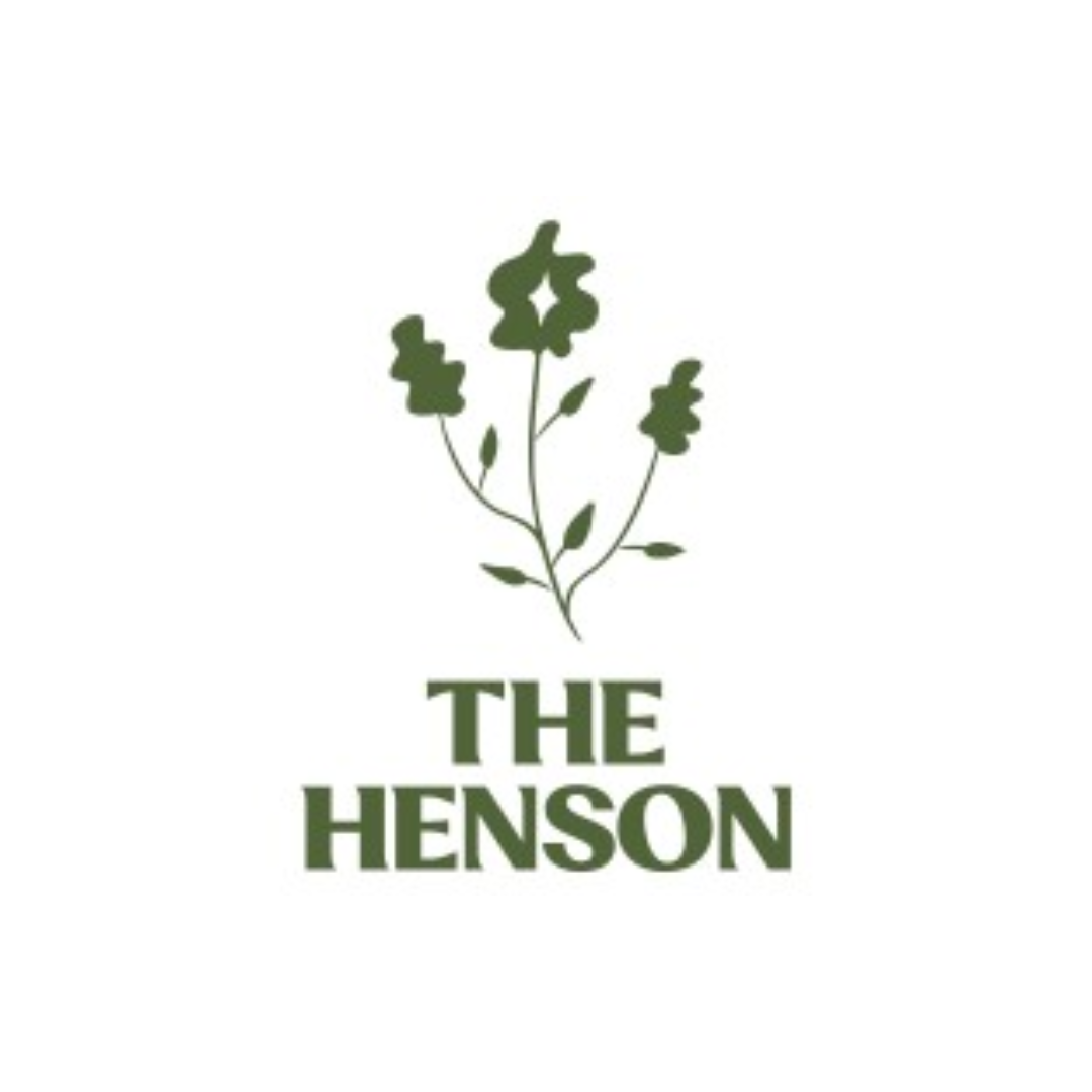 A green illustration of a flowering plant above the text "The Henson" in bold green letters.