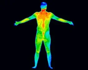 Thermal imaging of a person with arms outstretched, showing heat distribution.