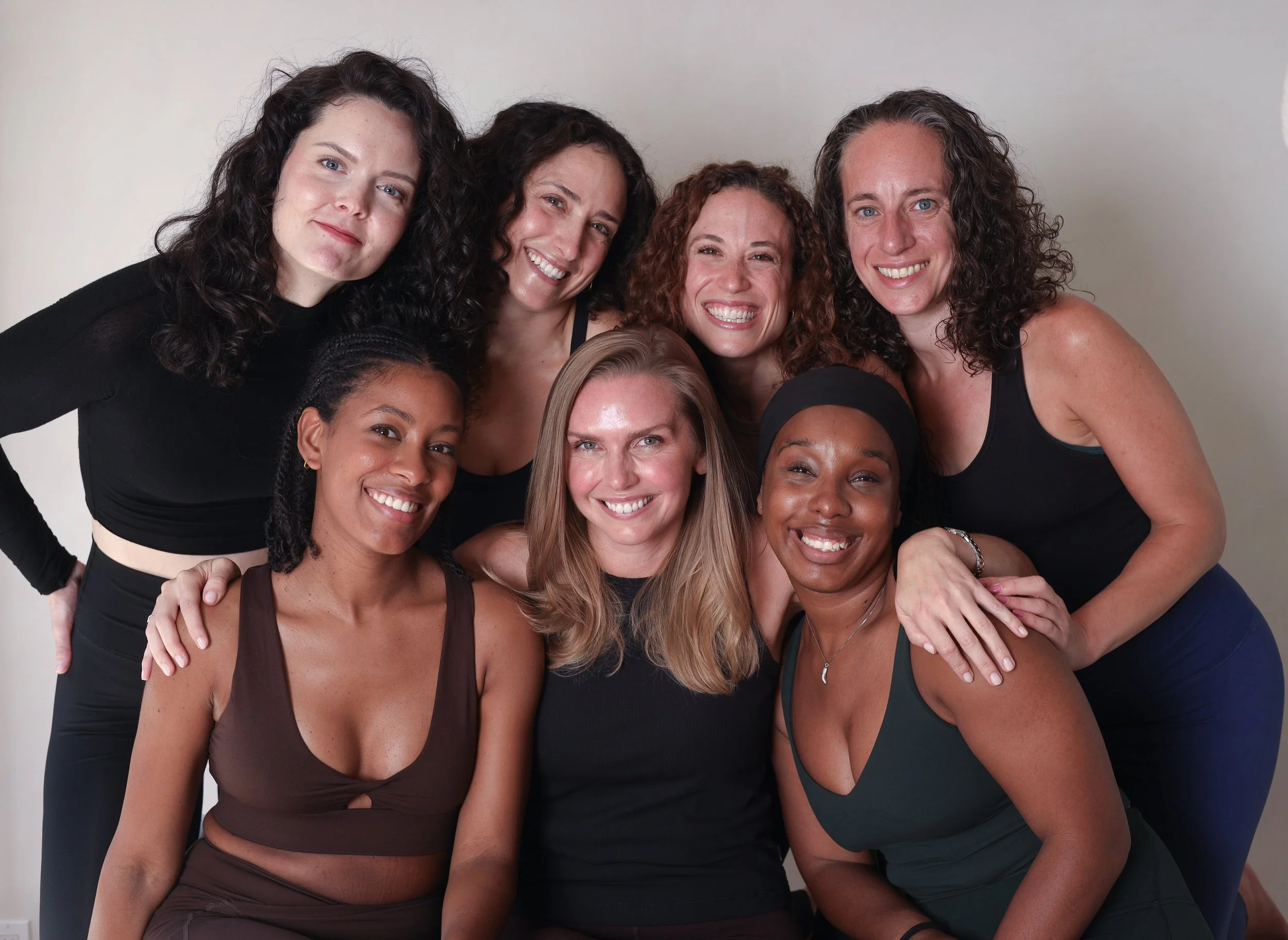 Pilates experts teaching reformer class at KIN Kollective Brooklyn studio