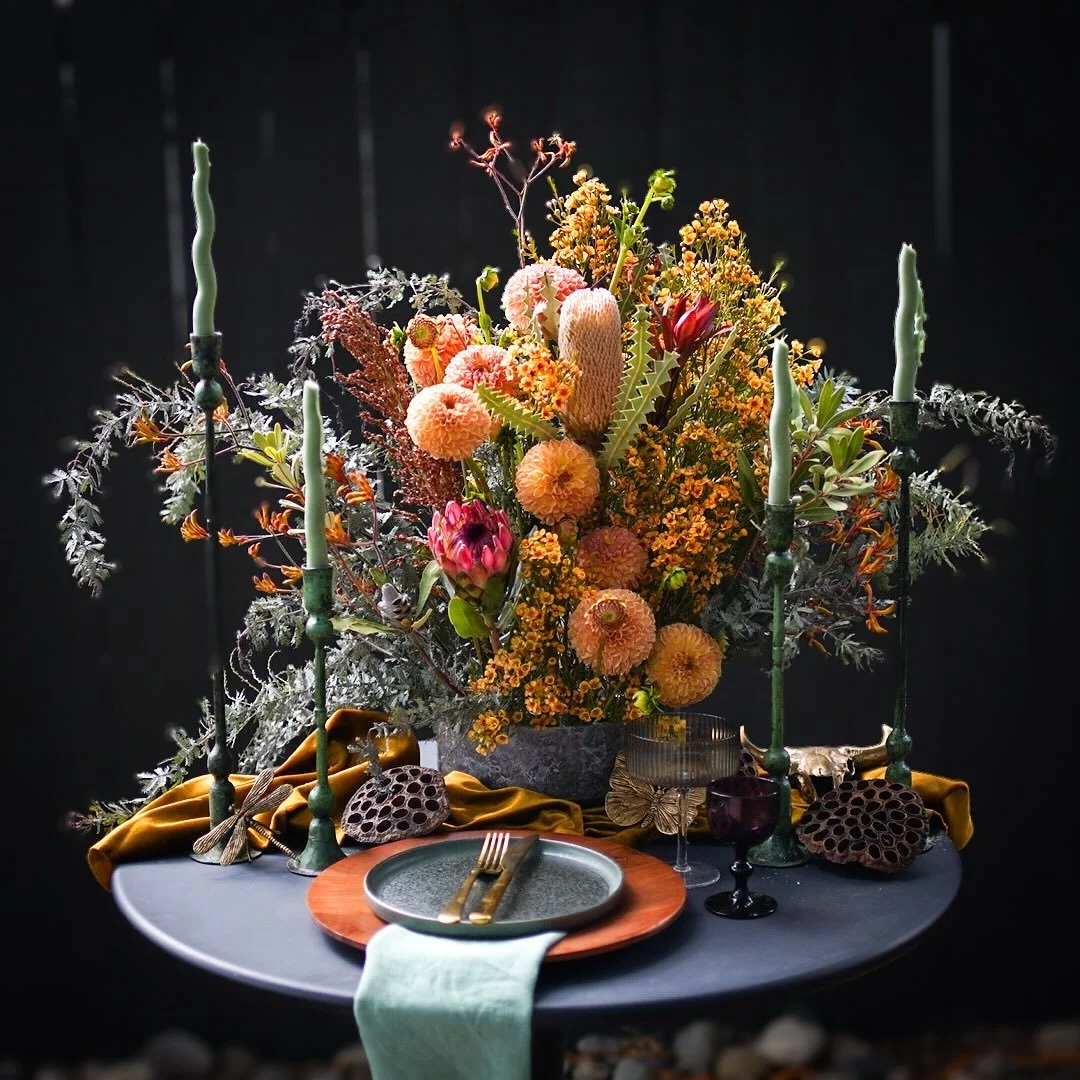 As summer sees her way out, she leaves behind a moment of balance &mdash; equal parts day and night. The season exhales, and for a brief breath, the scales still.

This table holds that balance. Light and shadow. Beauty and decay. The gold that glows
