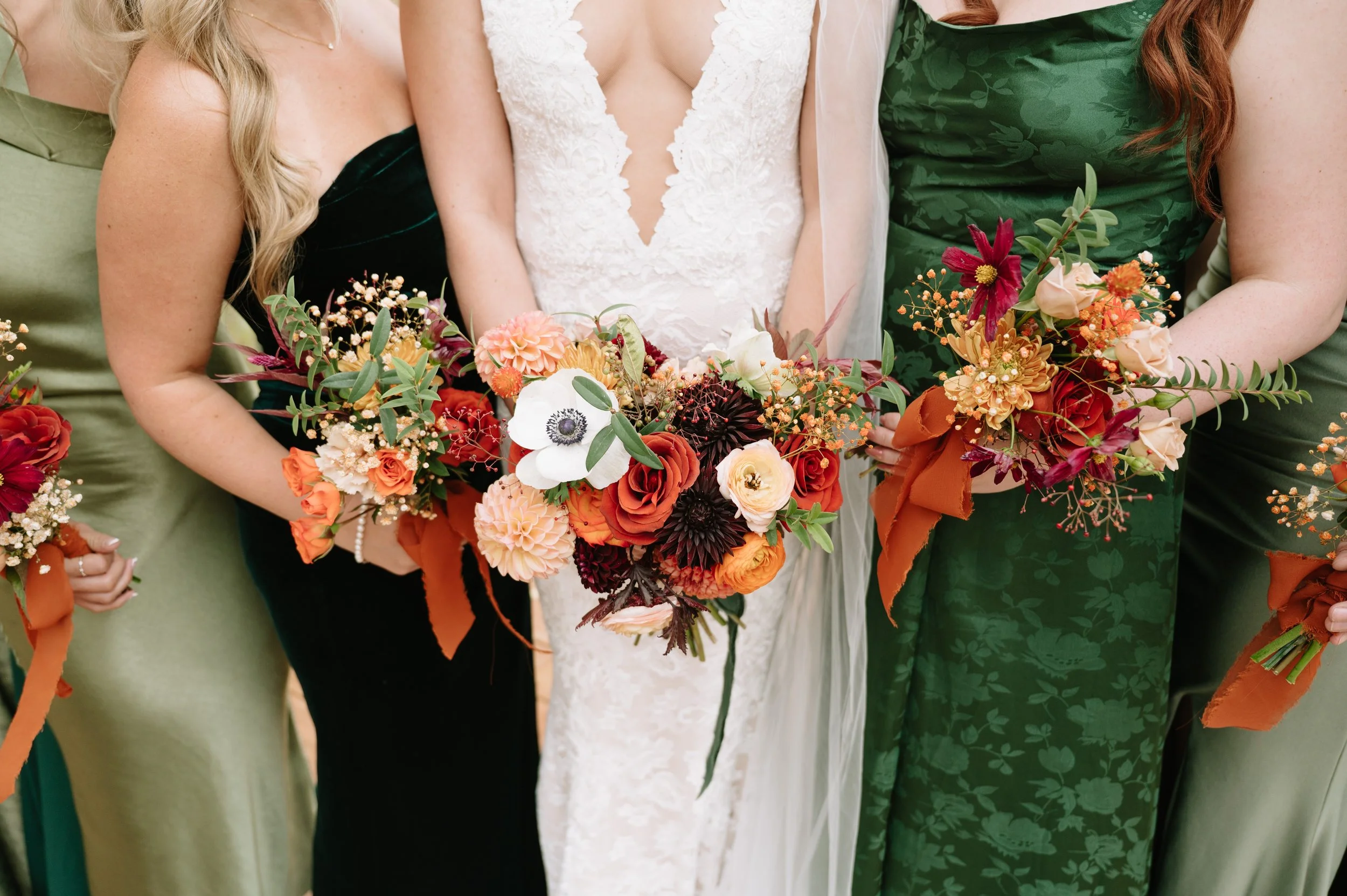 Bridal bouquet and bridesmaid florals created by Ash + Ether for a Colorado wedding, featuring warm autumn colors.