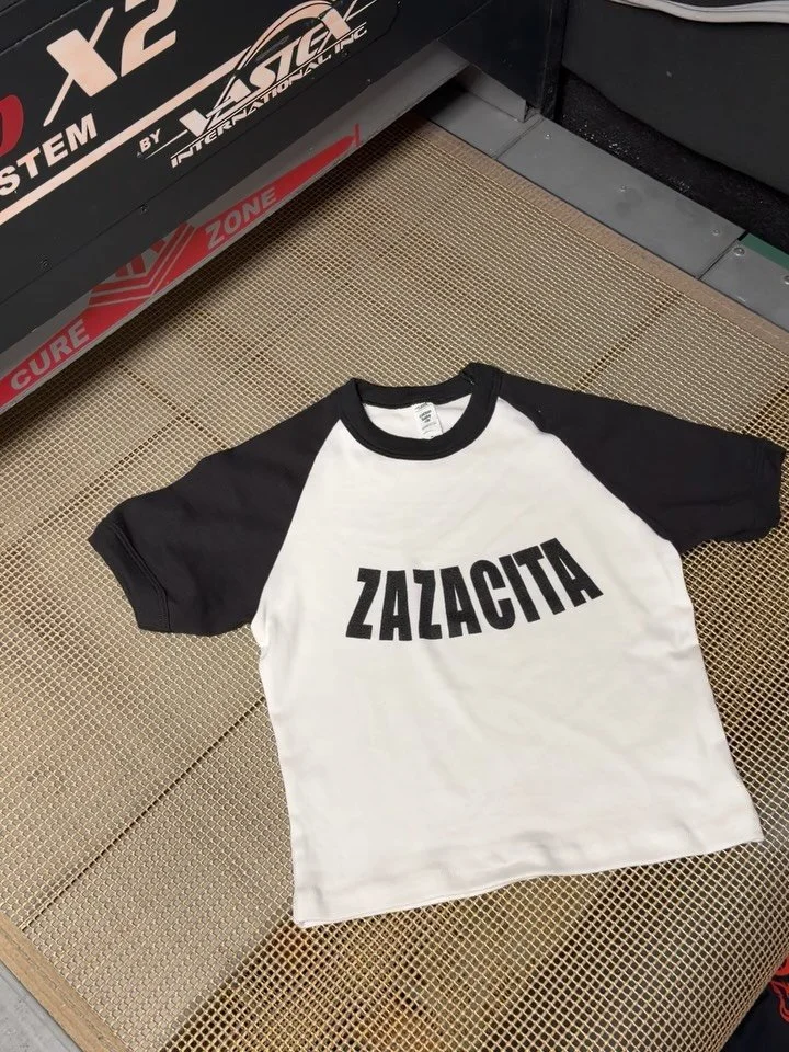 its 420 Too(2) 🍁🍃 so we&rsquo;re showing off @ktmaesec Zazacita baby tees printed on the popular @losangelesapparel baby tees 🎱
&bull;
DM or text us at (786) 914-3487 for a free quote TODAY! 📩📲
Offering the best screen printing, embroidery, and 