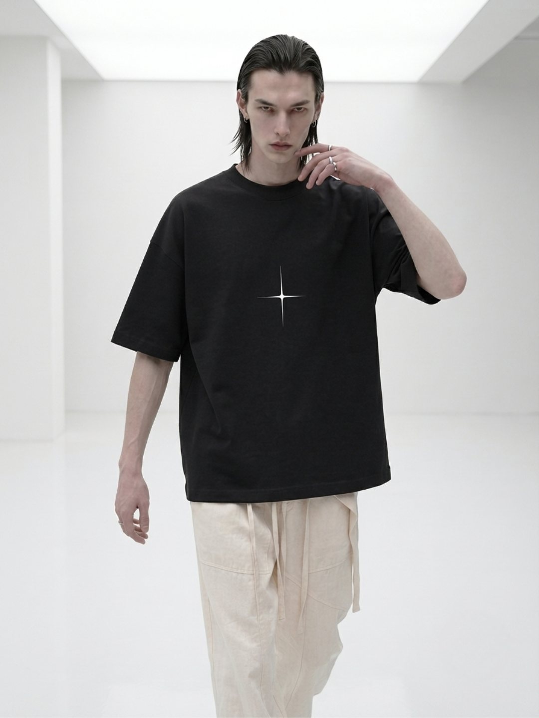 MODEL WEARING T SHIRT TECHNO STUDIOS  SYMBOL