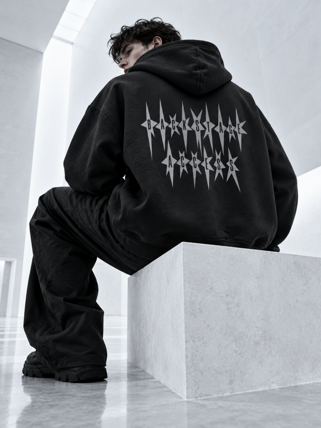 model wearing Techno Studios Hoodie Backstage