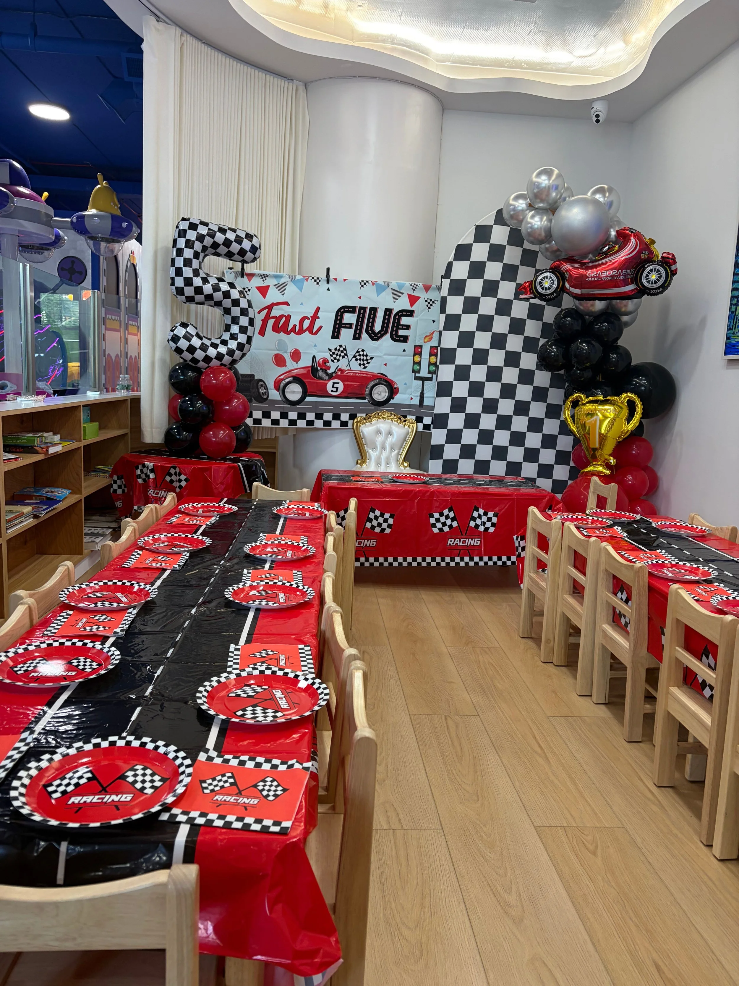 happy space playground - birthday parties - Race Car theme - indoor playground - party decorations - Race Car theme birthday party -Space  birthday backdrop - balloon garland - indoor playground birthday party