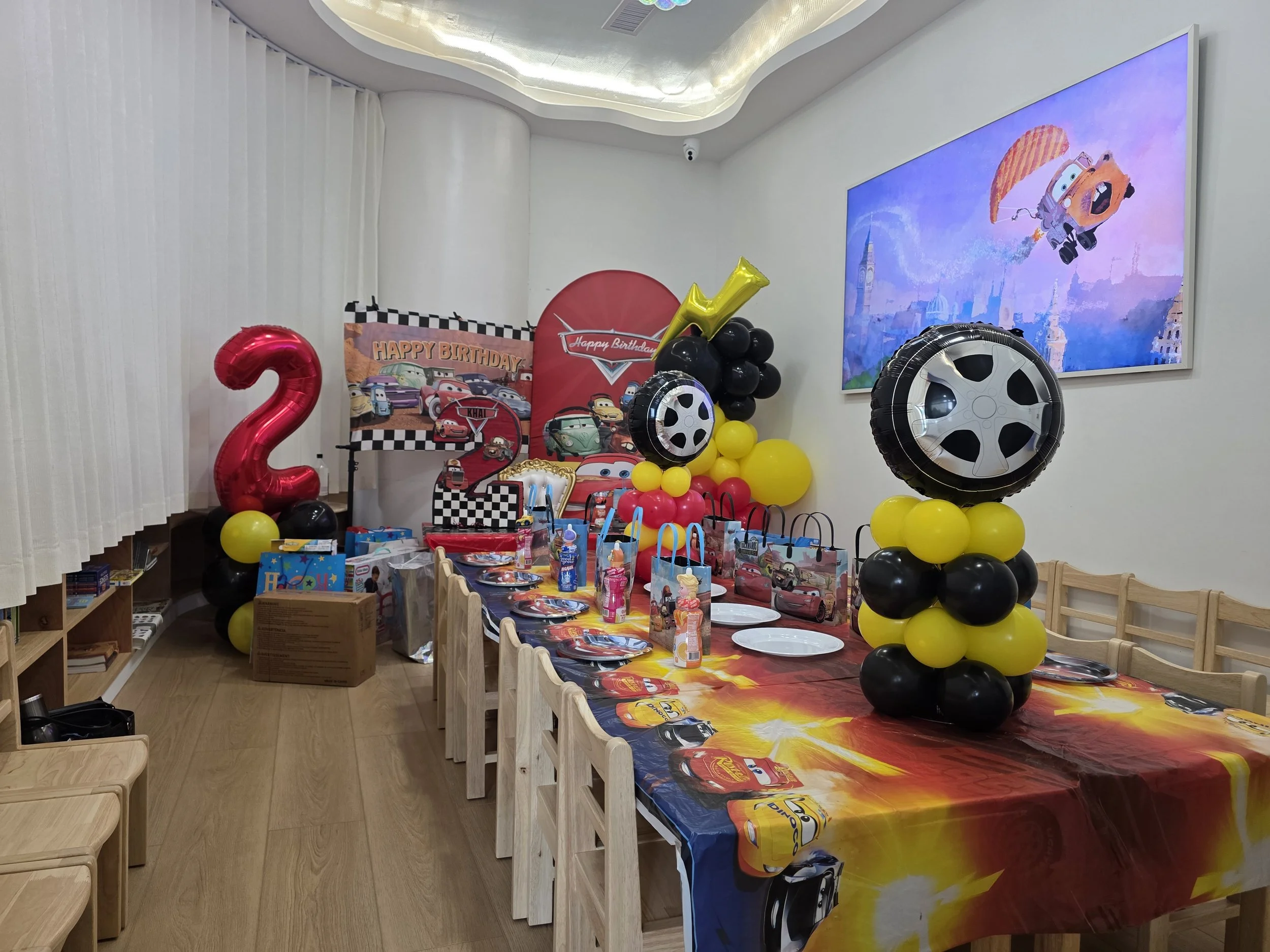 happy space playground - birthday parties - cars theme - indoor playground - party decorations - pixars cars theme birthday party - cars birthday backdrop - balloon garland