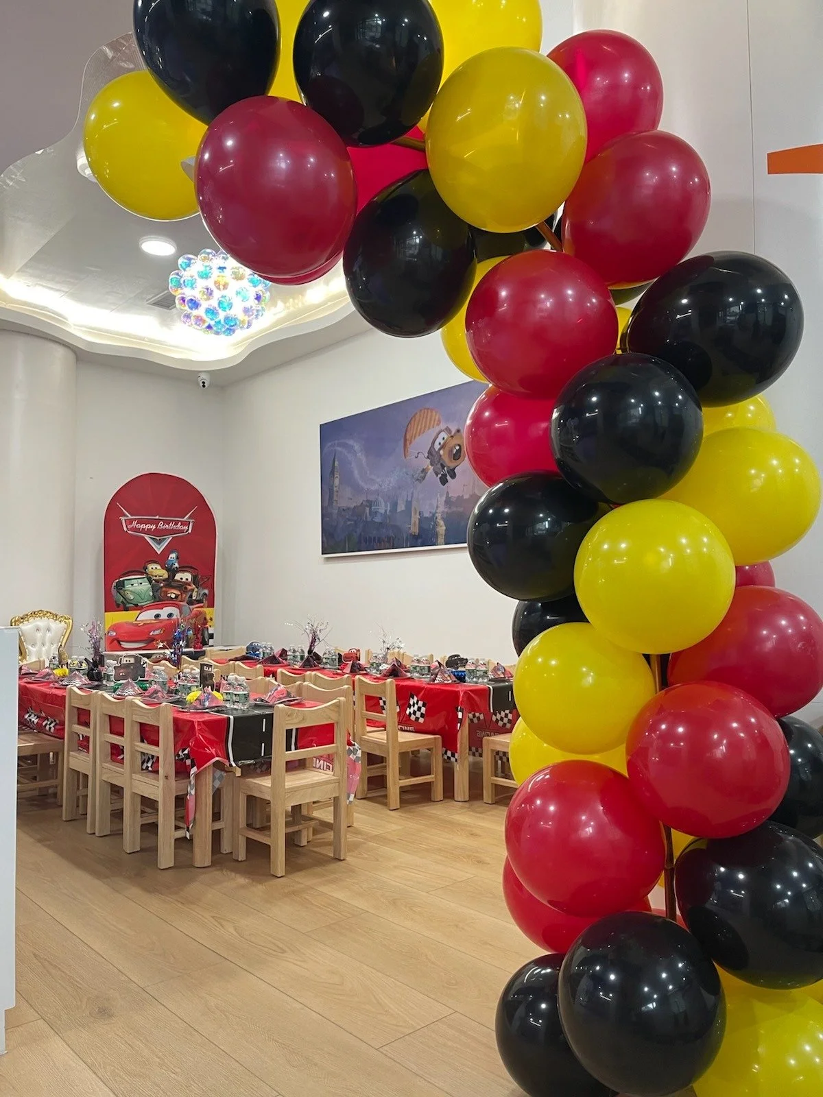 happy space playground - birthday parties - cars theme - indoor playground - party decorations - pixars cars theme birthday party - cars birthday backdrop - balloon garland