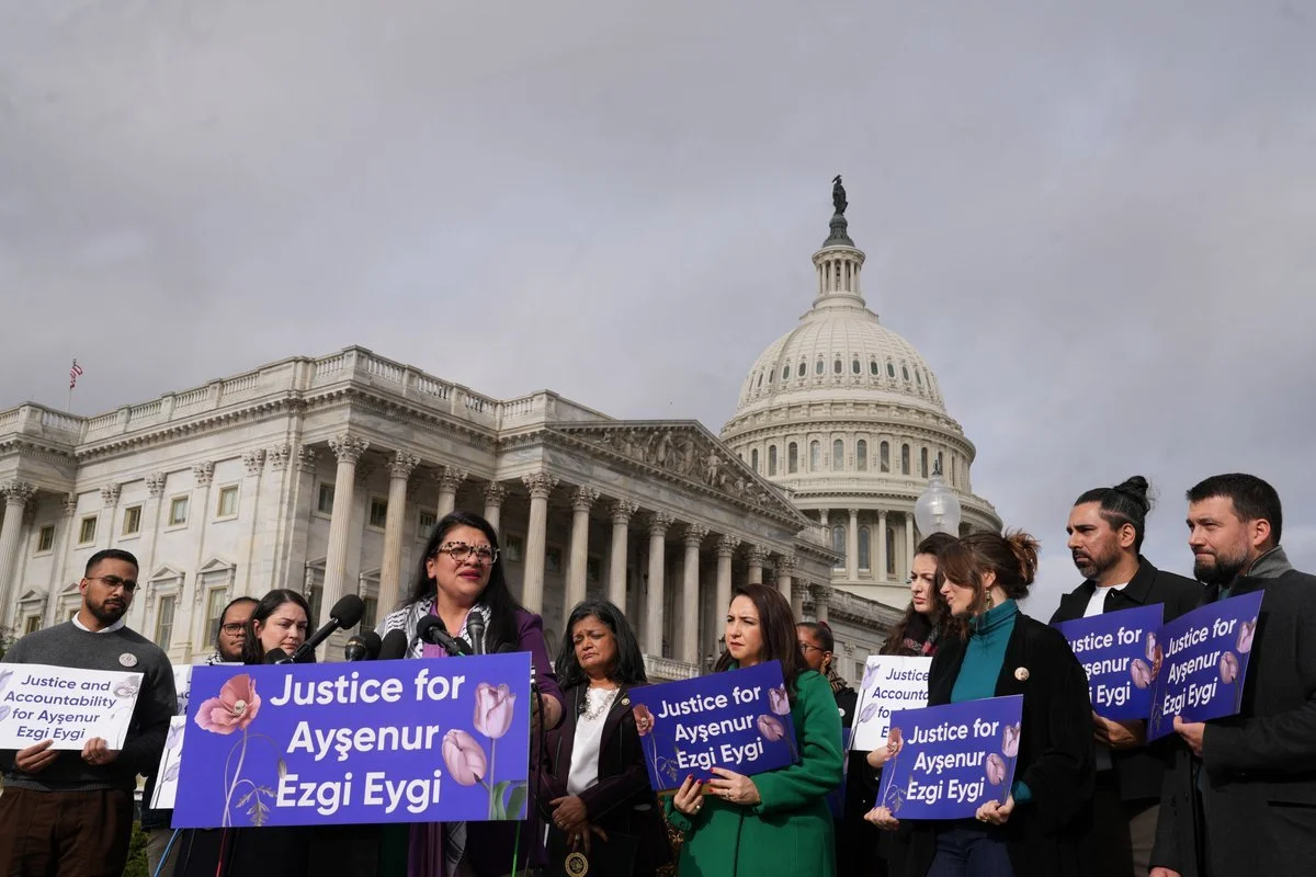 A group of people protesting outside the U.S. Capitol building, holding signs that say 'Justice for Aysenur Ezgi Egli'.
