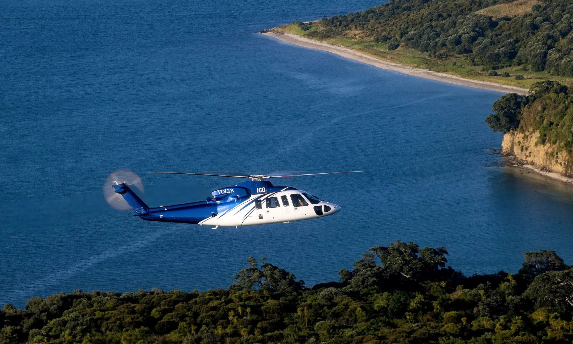 Helicopter Arriving at Opito Point Lodge - Luxury Accommodation in Coromandel, New Zealand