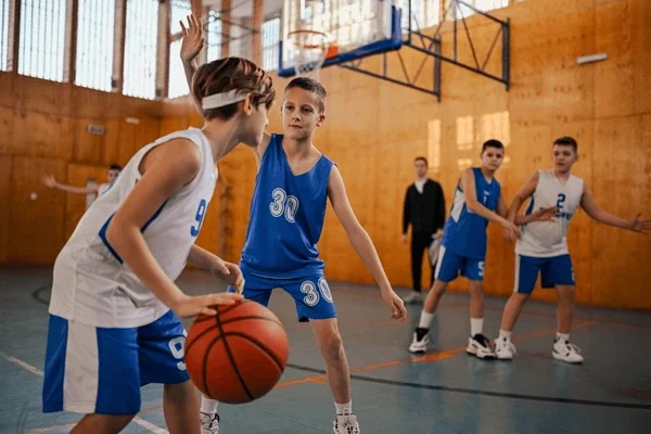 junior-basketball-player-dribbling-ball-600nw-2470660333.webp