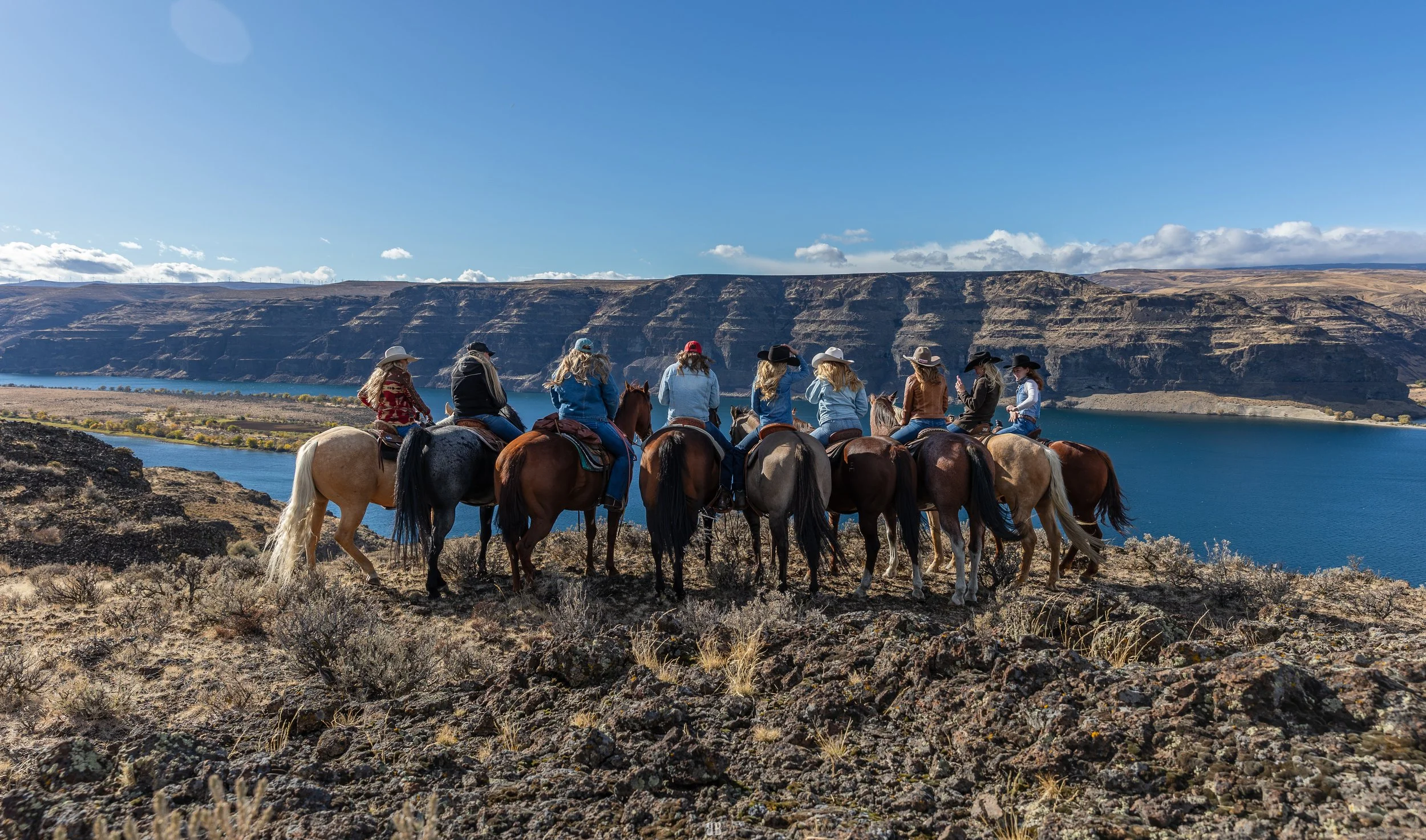 Aubree Skone leading a guided horseback trail ride at Sagecliffe Resort overlooking the Columbia River in Quincy, WA