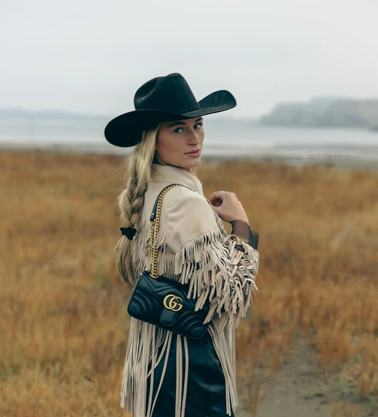 Aubree the cowgirl businesswoman posing by the Columbia River