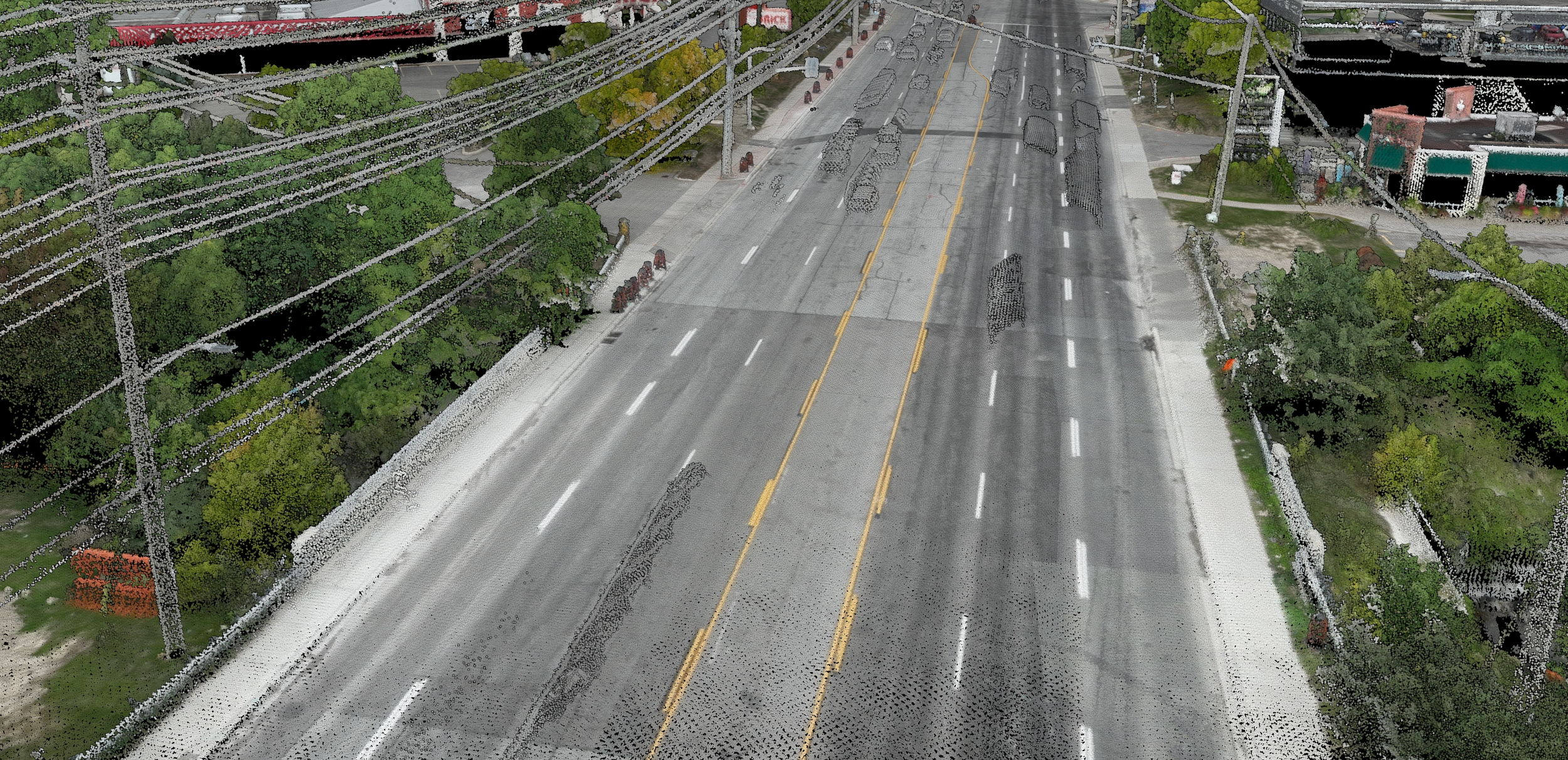 A drone flying over a lush green forested valley with a river flowing through it, overlaid with a digital visualization of a neural network in blue.