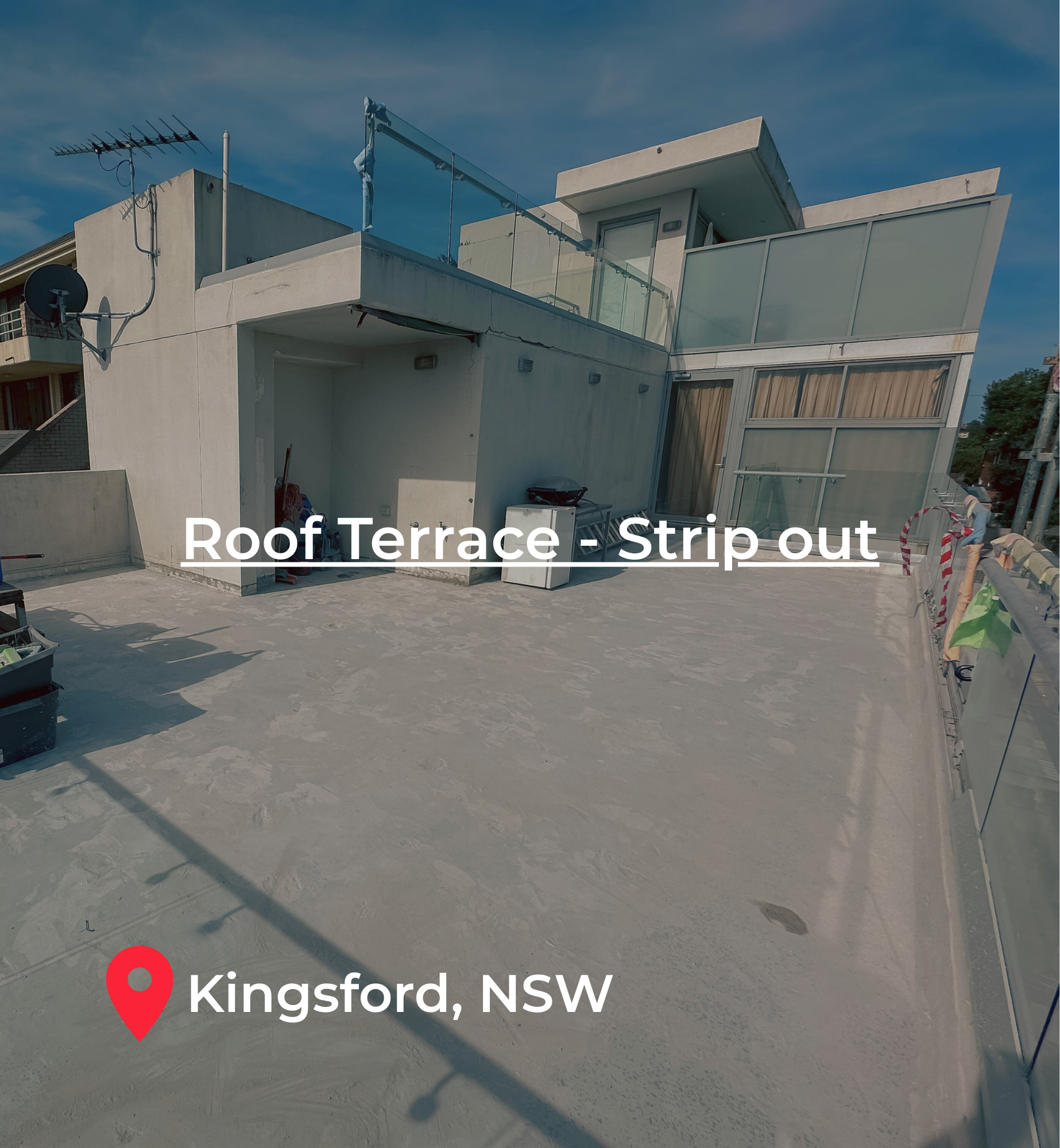 Empty flat roof terrace with construction materials and furniture, view of modern building with glass balcony, in Kingsford, NSW