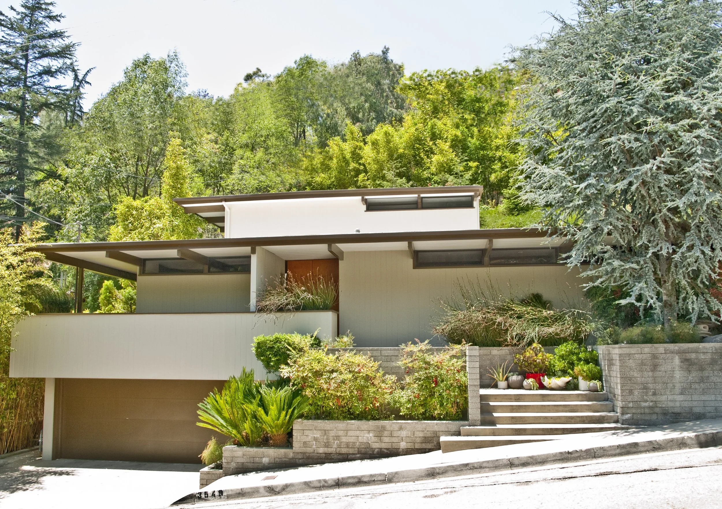 Architectural home designed by Calvin Straub FAIA, the Father of California Post and Beam Architecture, built in 1953. Features terrazzo floors, open indoor-outdoor layout, floor-to-ceiling glass, luxurious master suite with soaking tub and steam sho