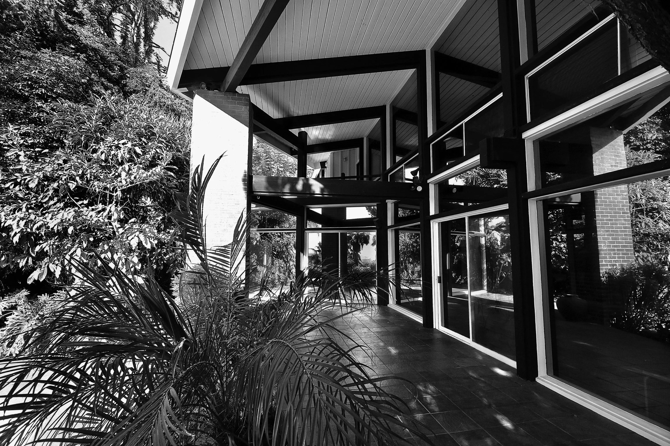 Mid-century post and beam architectural home in Hollywood Hills, designed by Burton Schutt in 1954. The Landsberg Residence features a unique multi-sided form, 3 bedrooms, 3 bathrooms, a double-exposed fireplace, spacious eat-in kitchen with wood-bur