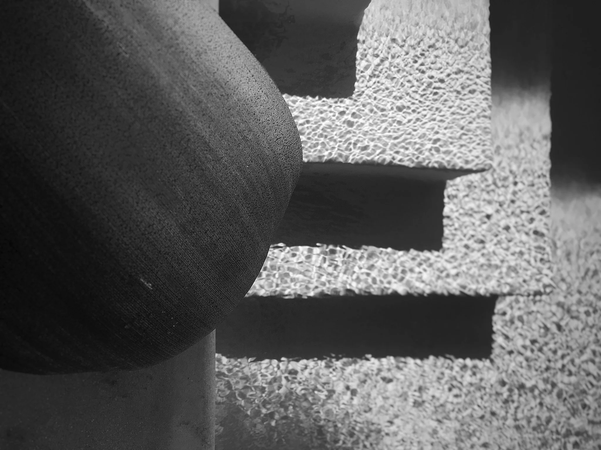 Missig Team, a real estate team at Berkshire Hathaway HomeServices California Properties in Beverly Hills and Los Angeles. Phil Missig's artistic photo of palm franz on a pool step. Geometric shapes and lines.