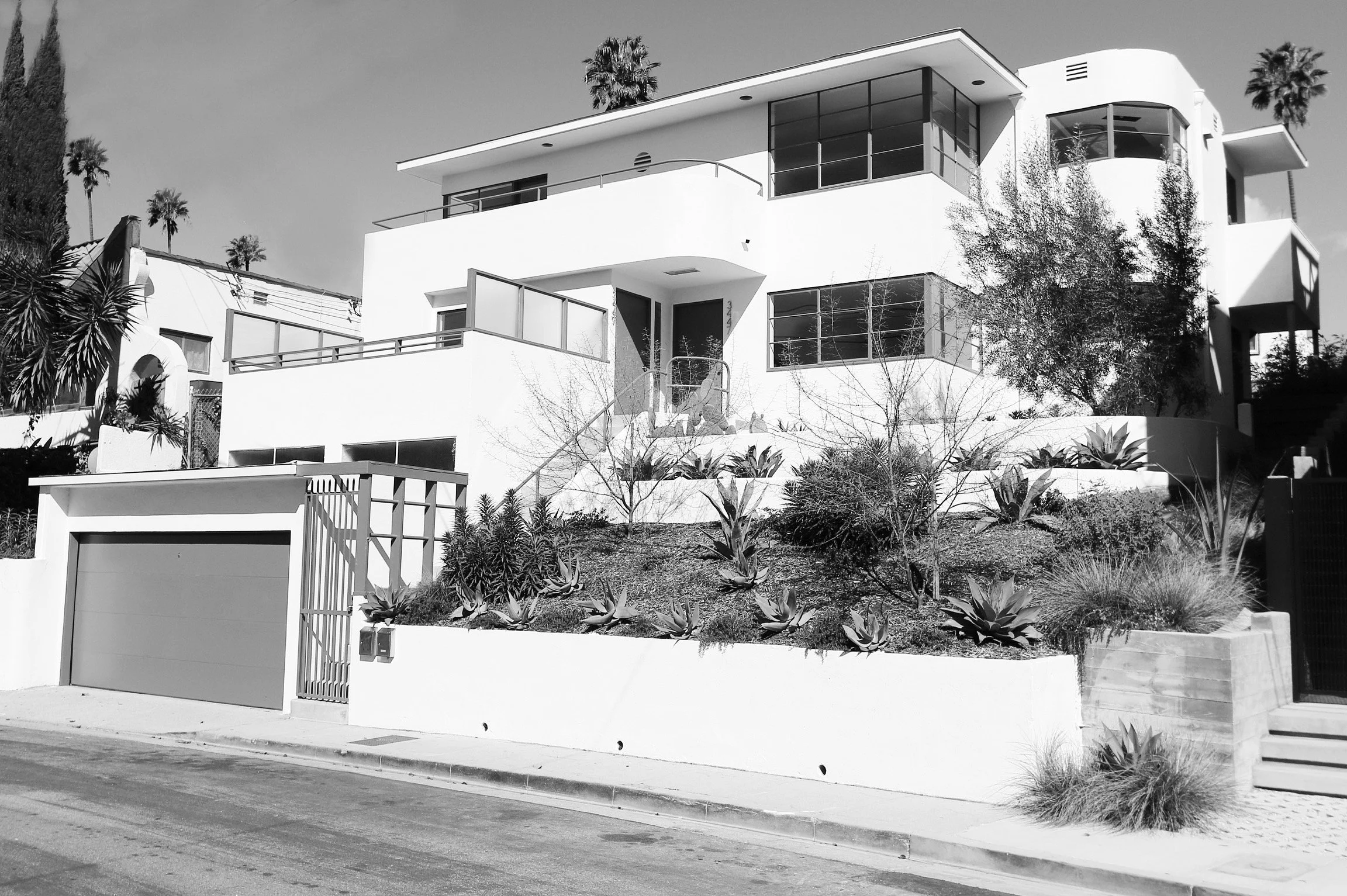 The Walter Daniels Duplex, a Historic-Cultural Monument in Silver Lake, is a rare and excellent example of Streamline Moderne multi-family architecture. Features a 3-bedroom, 2-bath lower unit with landscaped garden and patio, and a 2-bedroom, 1-bath