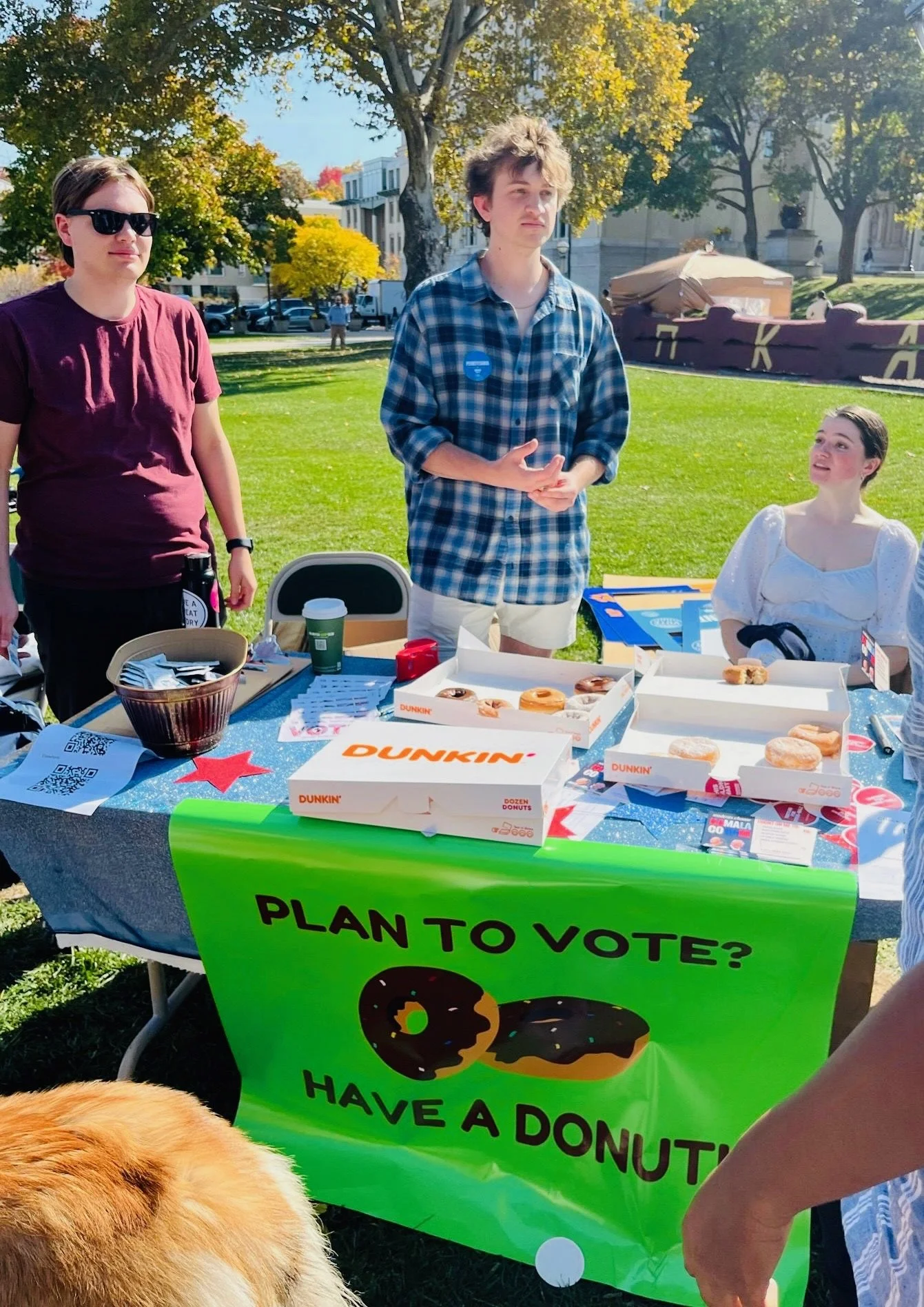 College student organizers at Donuts and Democracy table.