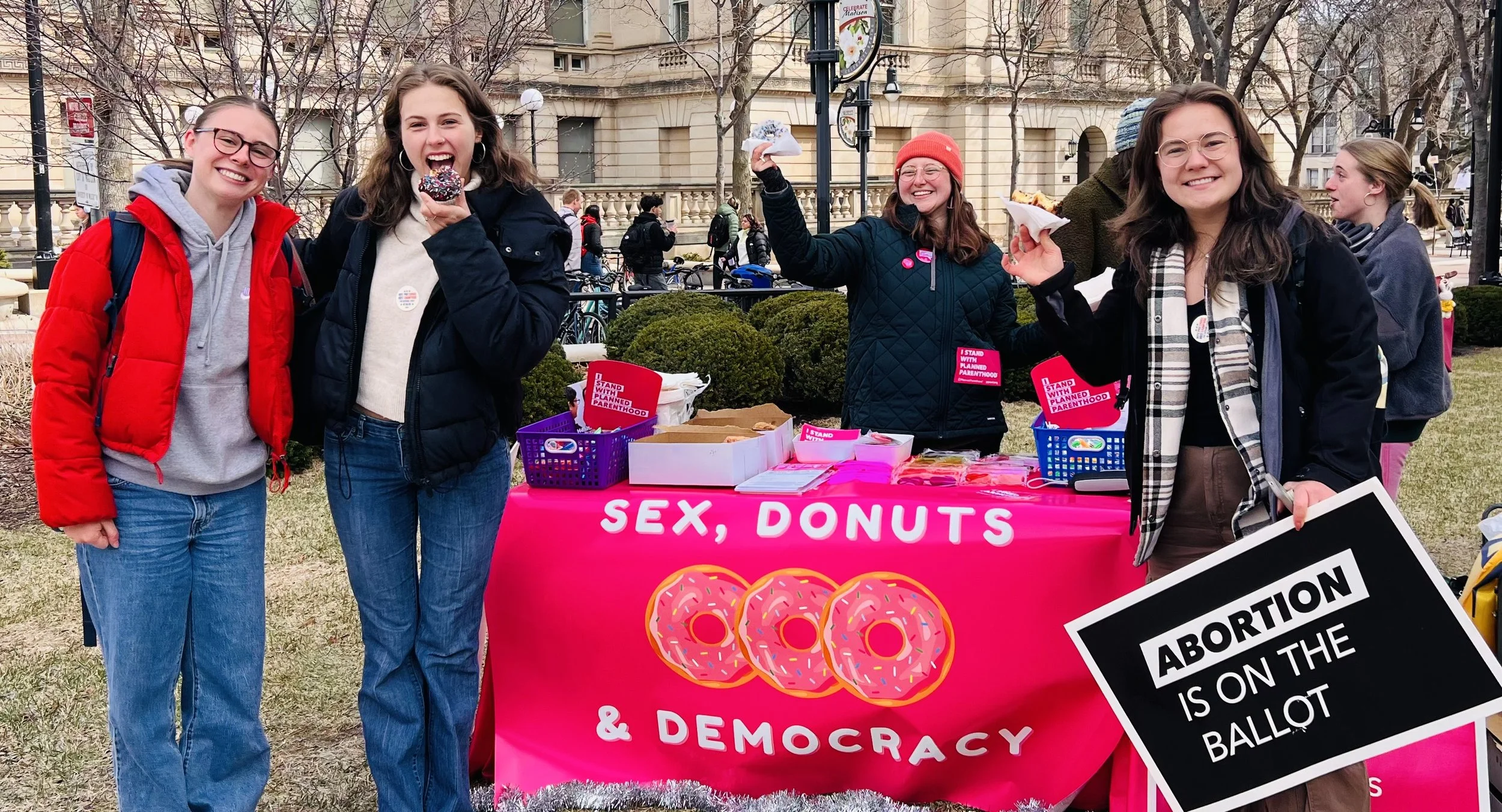 Sex, donuts & democracy get out the vote table at University of Wisconsin.