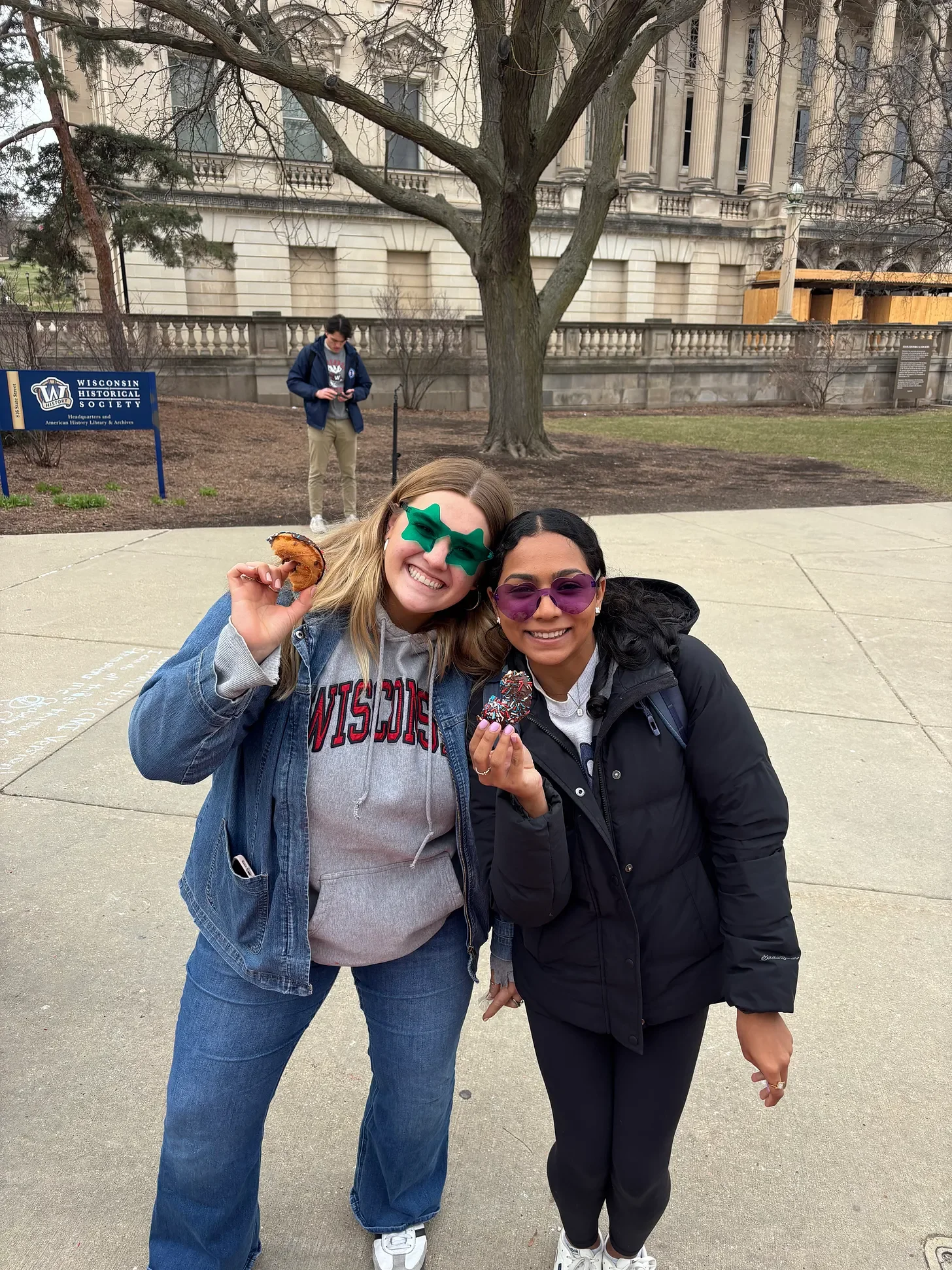 College students with donuts at Donuts and Democracy table.
