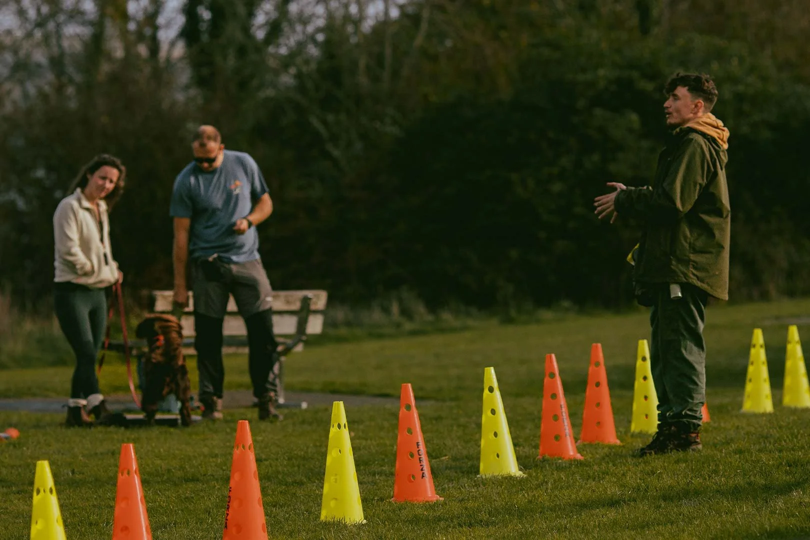 Elliot, a gundog trainer in Cornwall, teaching a loose lead walking game at a dog training class in Falmouth