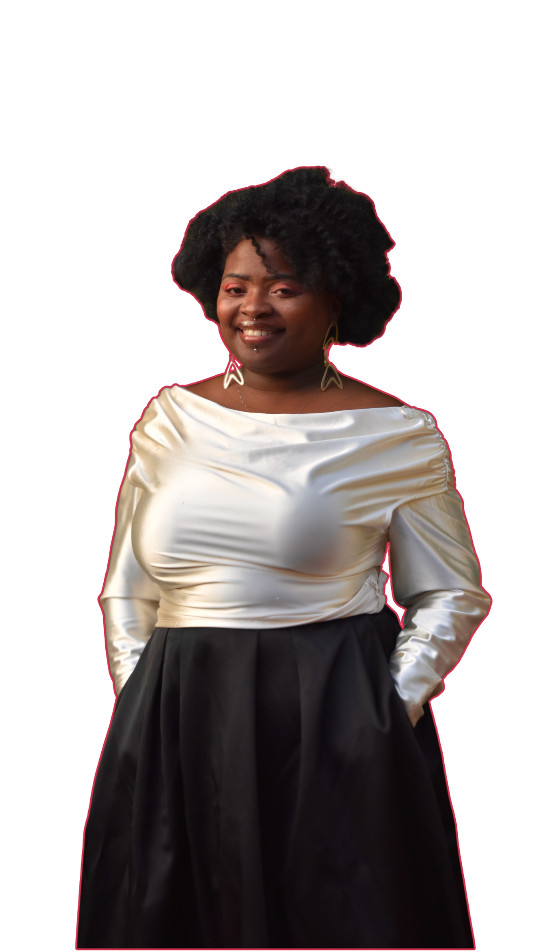 Erica smiling, wearing large arrow-shaped earrings, a shiny cream-colored satin top with puffed sleeves, and a black skirt.