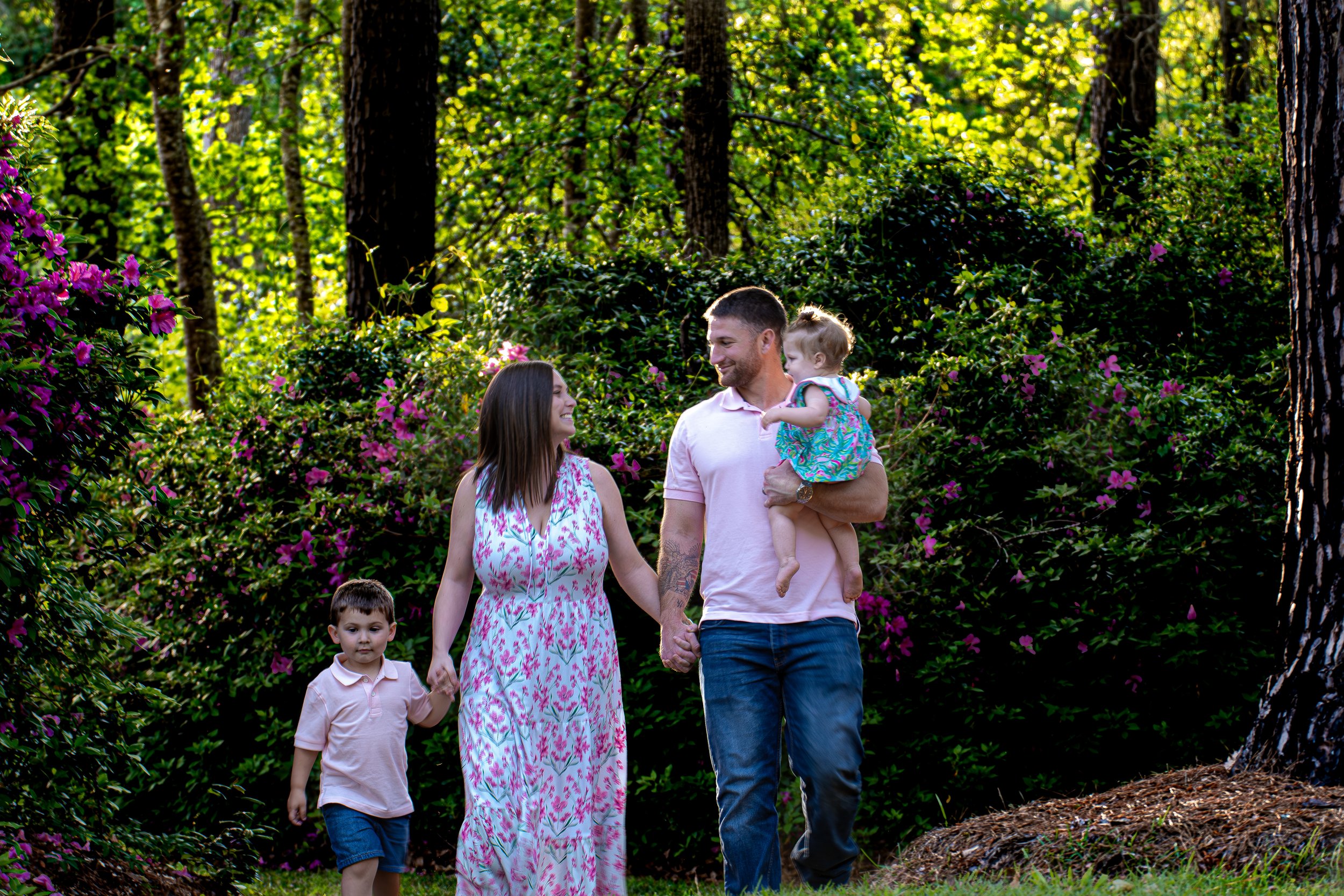 “Family walking together during an outdoor legacy photography session in Eastern North Carolina”