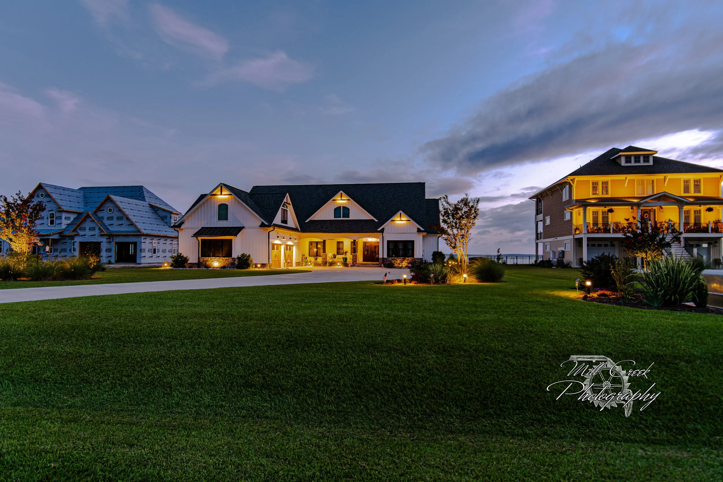 "Neighbors on the Point"
A wide blue-hour view of neighboring coastal homes with the sound shimmering just beyond.