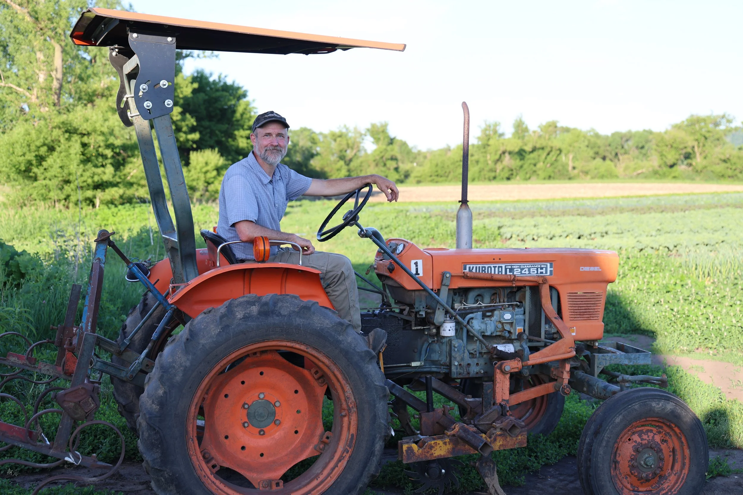 Jack Hedin on one of the tractors used at Featherstone Farm.