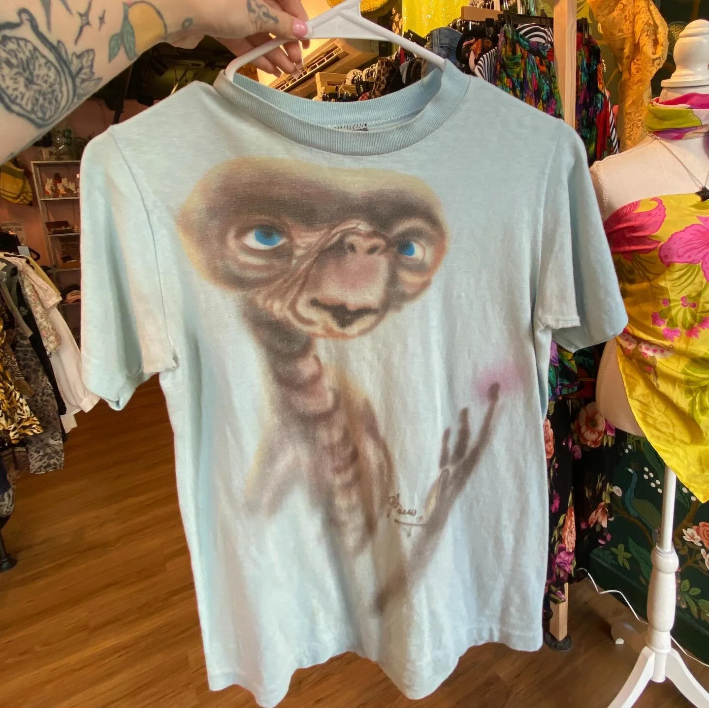 saying goodbye to the airbrushed ET tshirt that sam and i wanted to keep but instead SOLD bc we are responsible business owners and very normal women who do NOT have a hoarding problem 😇