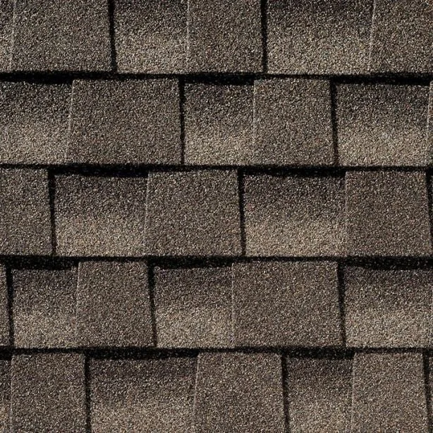 Close-up view of a section of roof shingles in dark gray color.