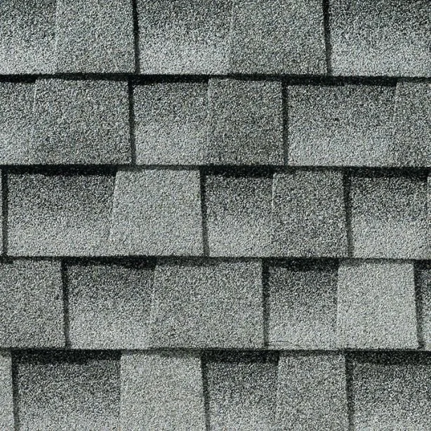 Close-up image of gray asphalt roof shingles arranged in overlapping rows.