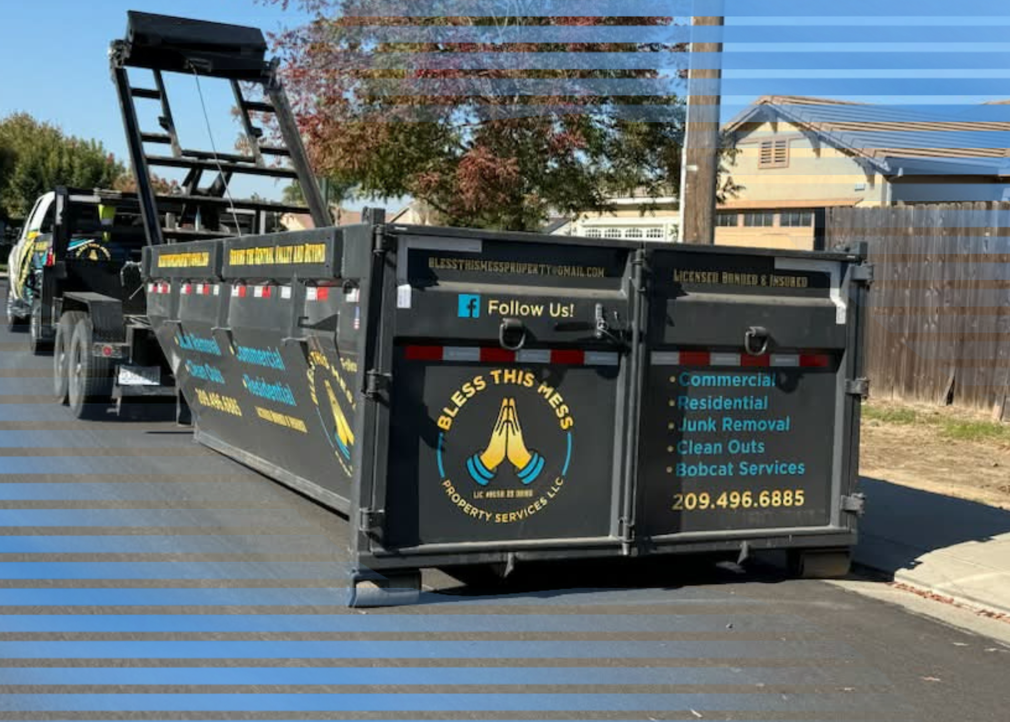 Bless This Mess dumpster parked on the street beside a sidewalk to load up with junk for removal.