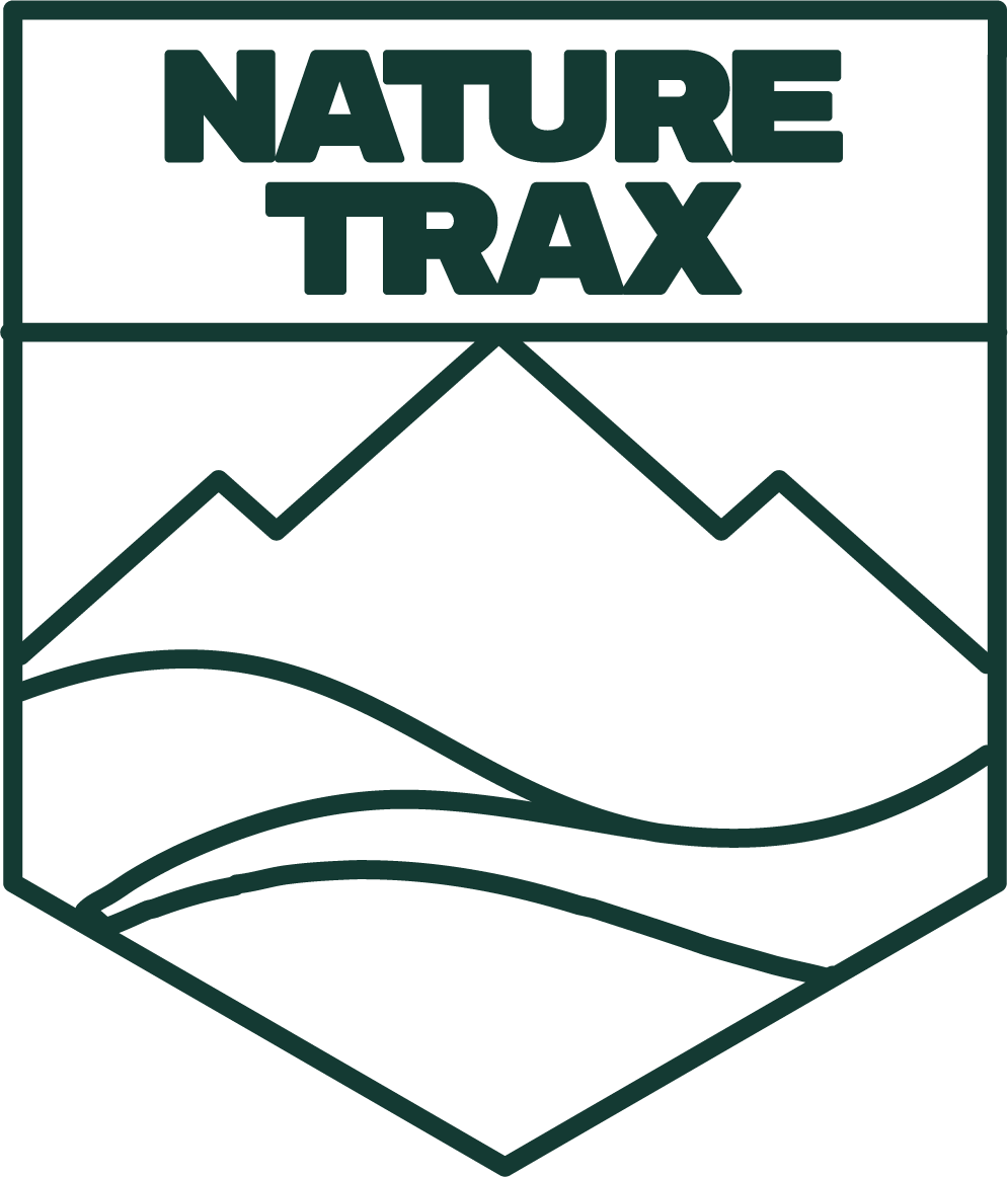 Logo with the text 'NATURE TRAX' and stylized mountain and field landscape.