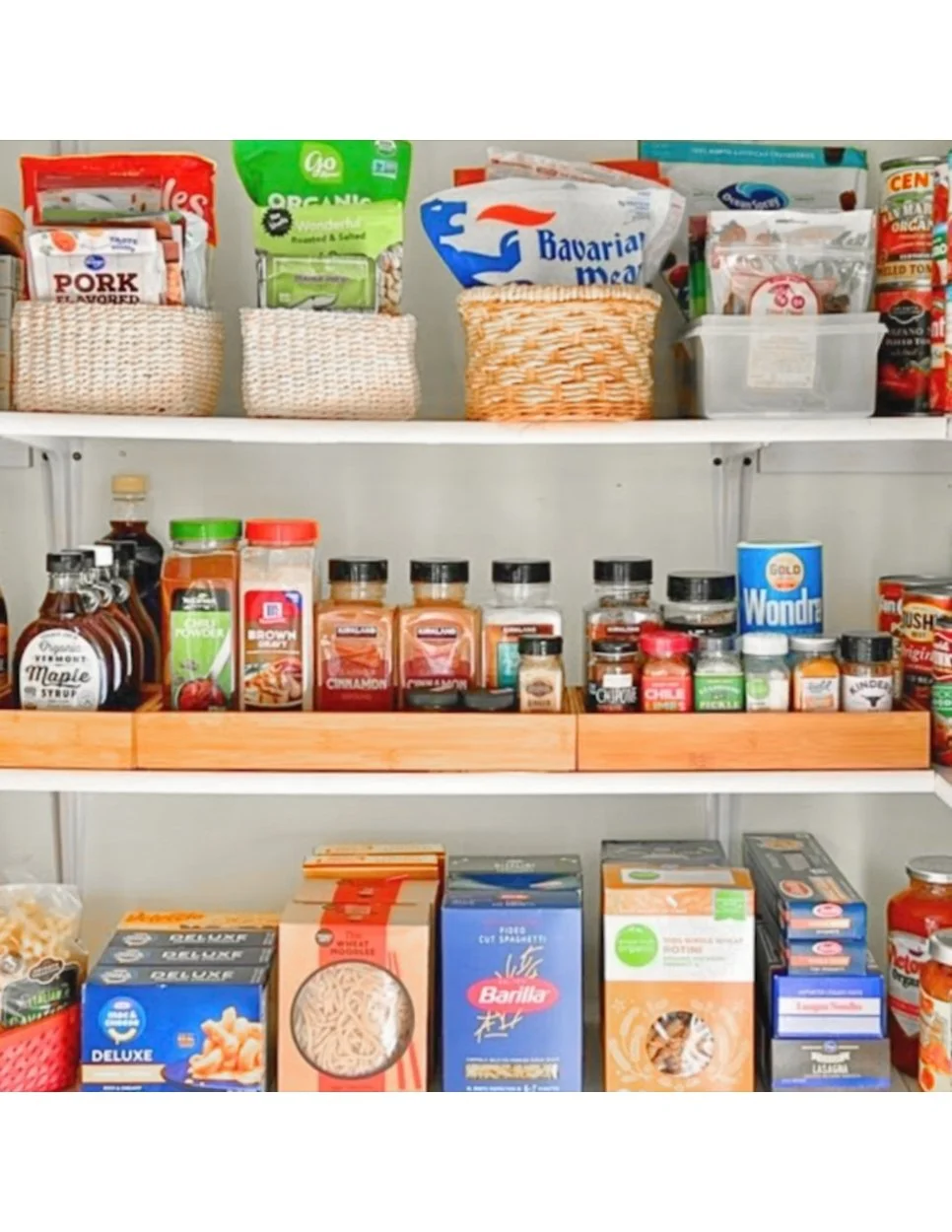 Organized pantry with categorized food and clear storage bins