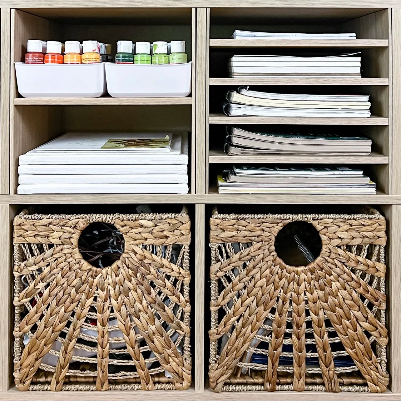 Organized shelving with paperwork, supplies, and woven storage baskets