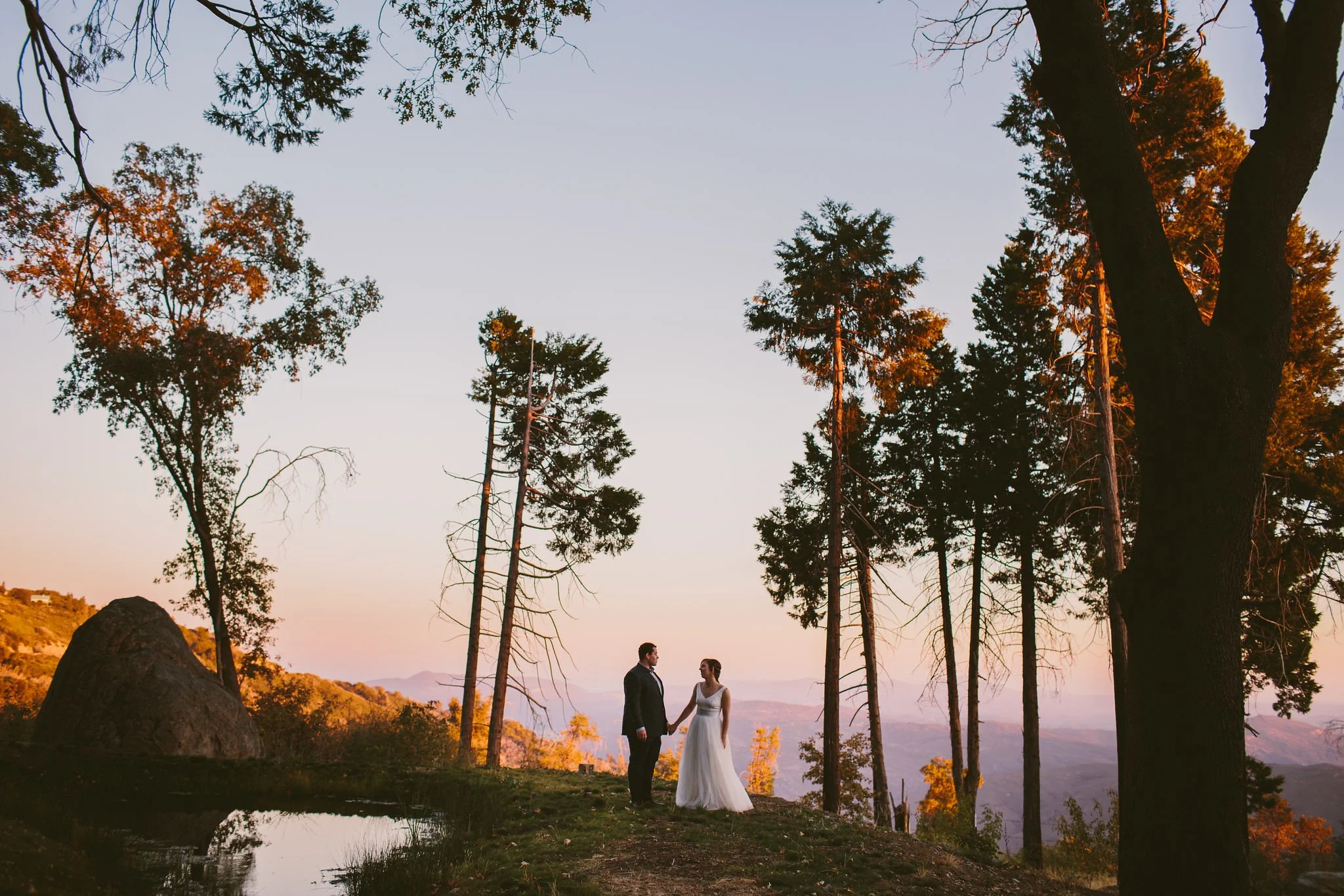 Couple in the mountains on their at sunset on their wedding day-  Idaho Fine Art Wedding Photographer