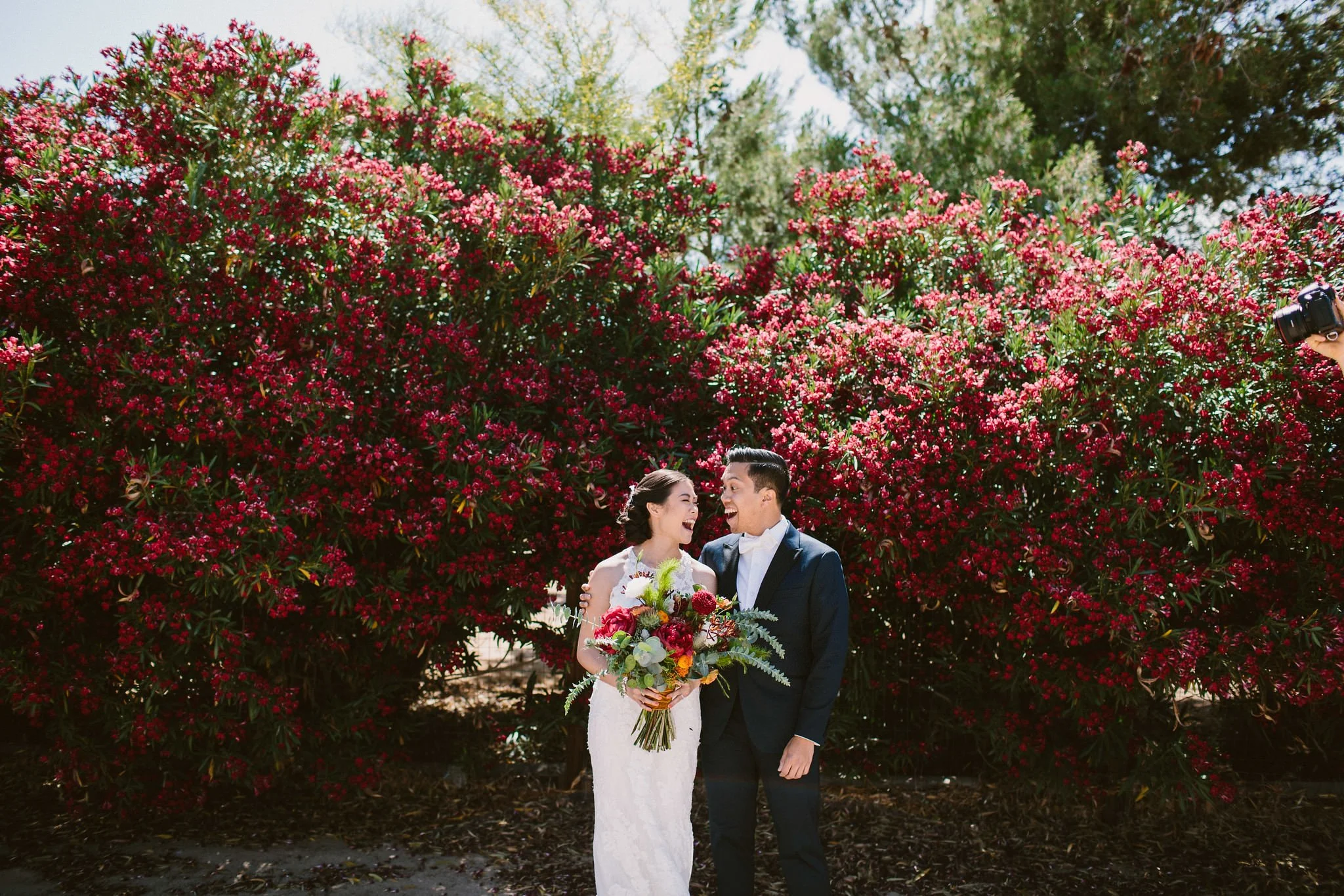Bride and groom laughing candidly together- - Boise, Idaho Fine Art Wedding Photographer