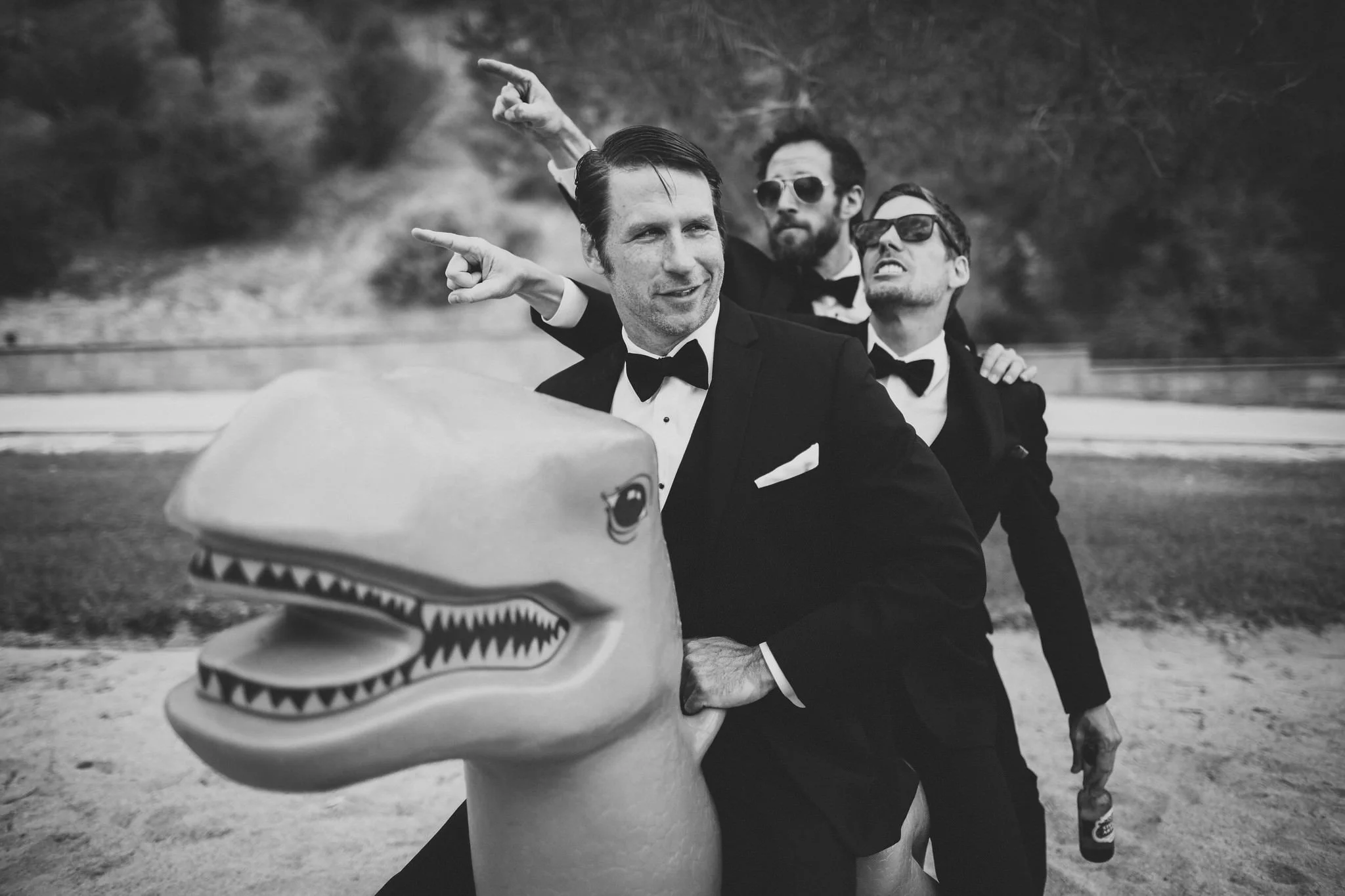 Groom and groomsmen on a dinosaur- Boise, Idaho Documentary Wedding Photographer