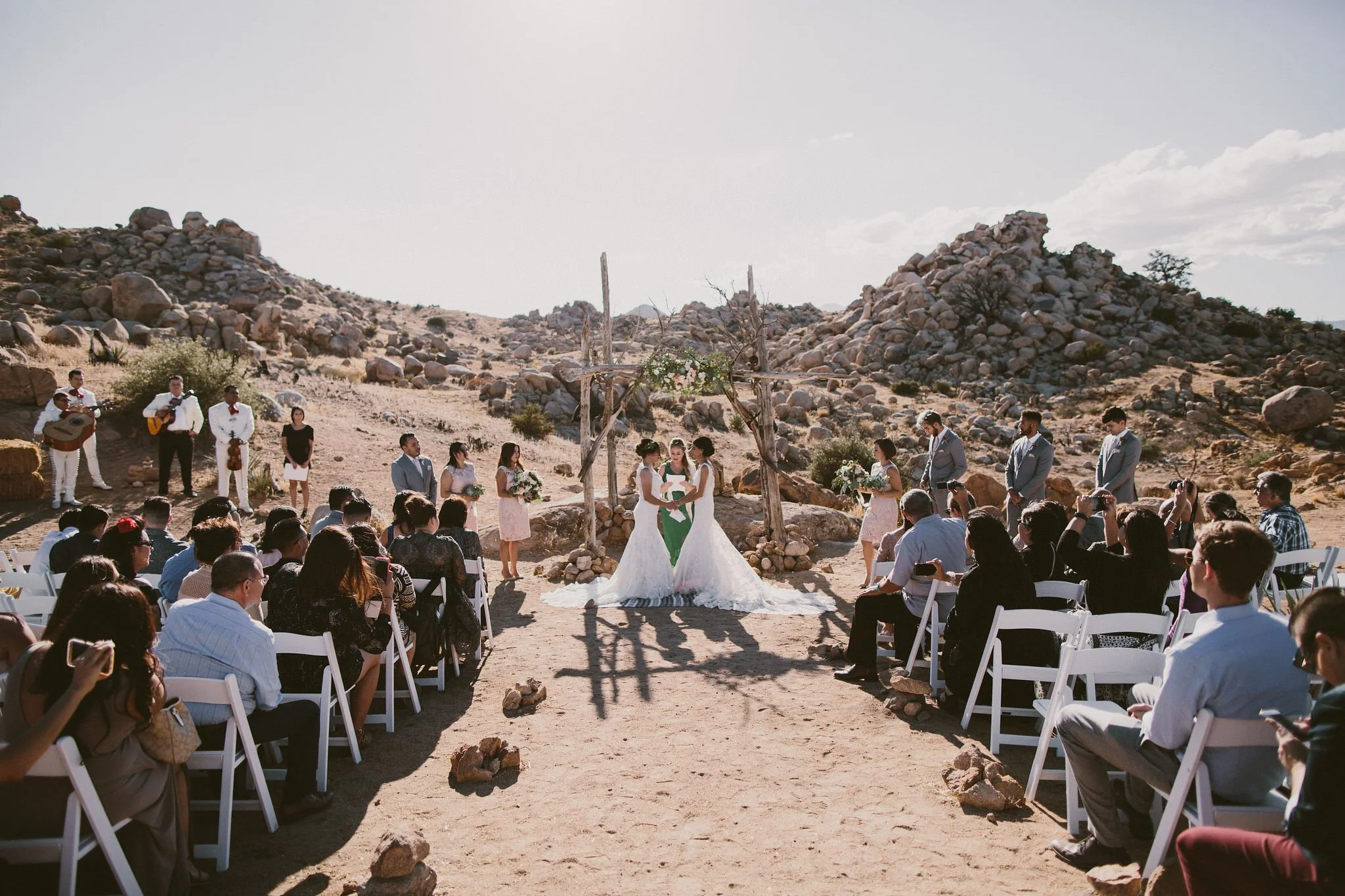 Ceremony with two brides wearing matching dresses in the desert- Sun Valley, Idaho Fine Art Wedding Photographer