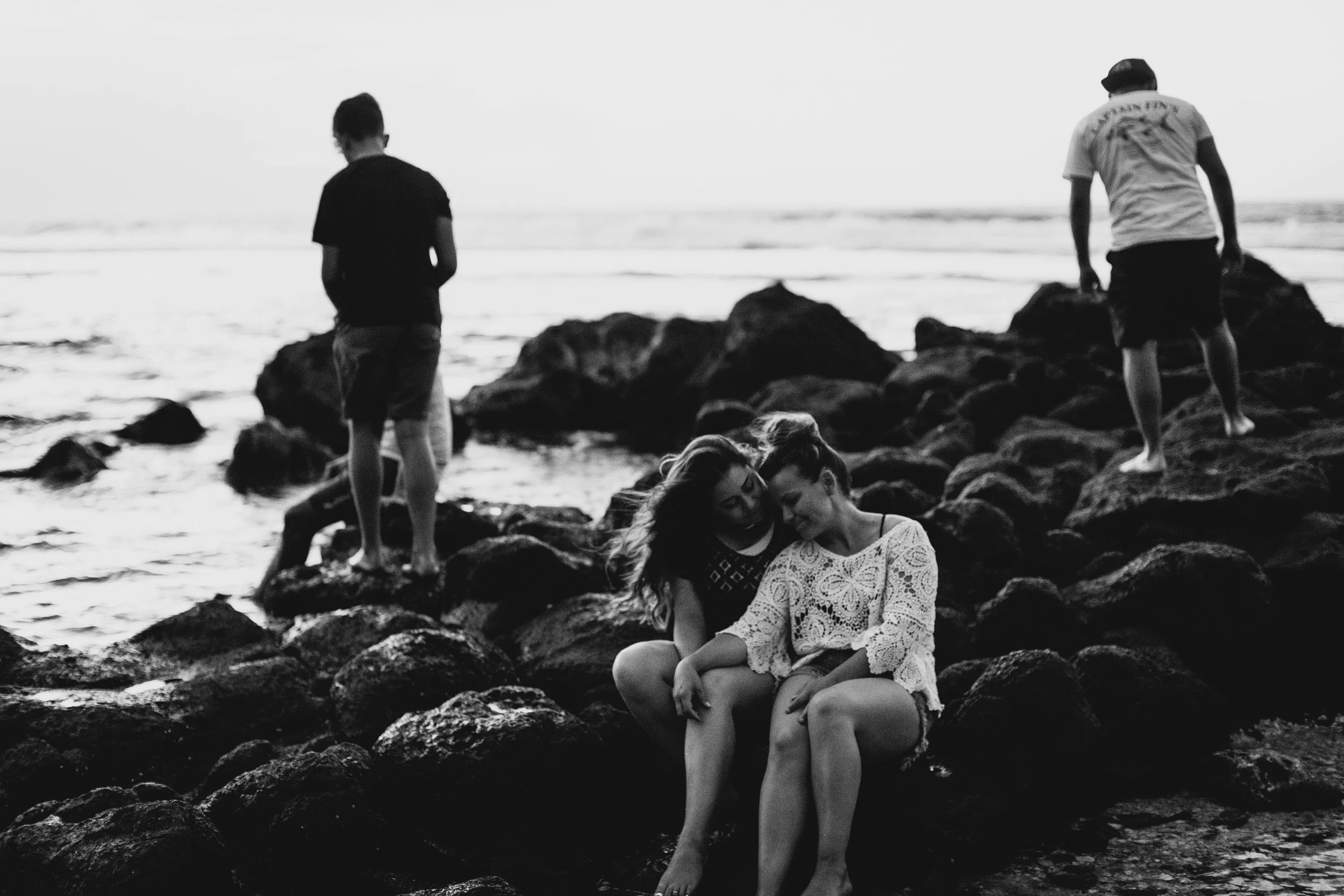 black and white photo of family enjoying Hawaii beach