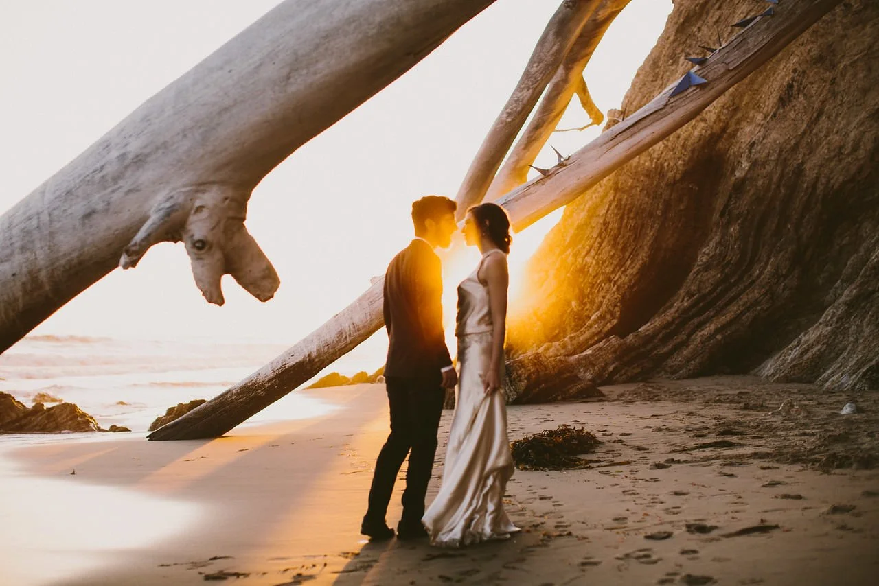 Bride and groom on Santa Barbara beach at sunset- Destination Fine Art Wedding Photographer