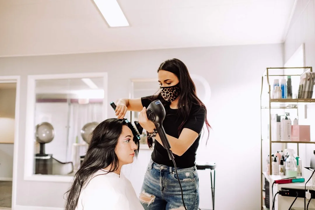 Alexandra preparing a romantic bridal style with hair extensions in west des moines