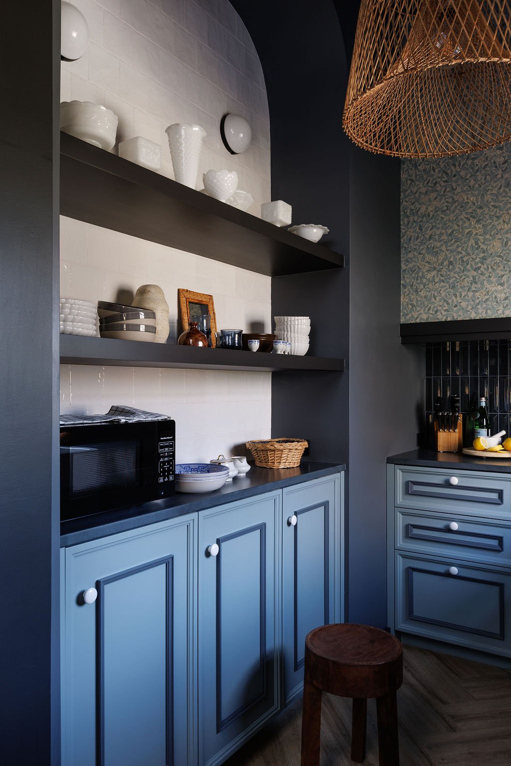 Sleby Hotel kitchen arched display shelving with dishes and decor.